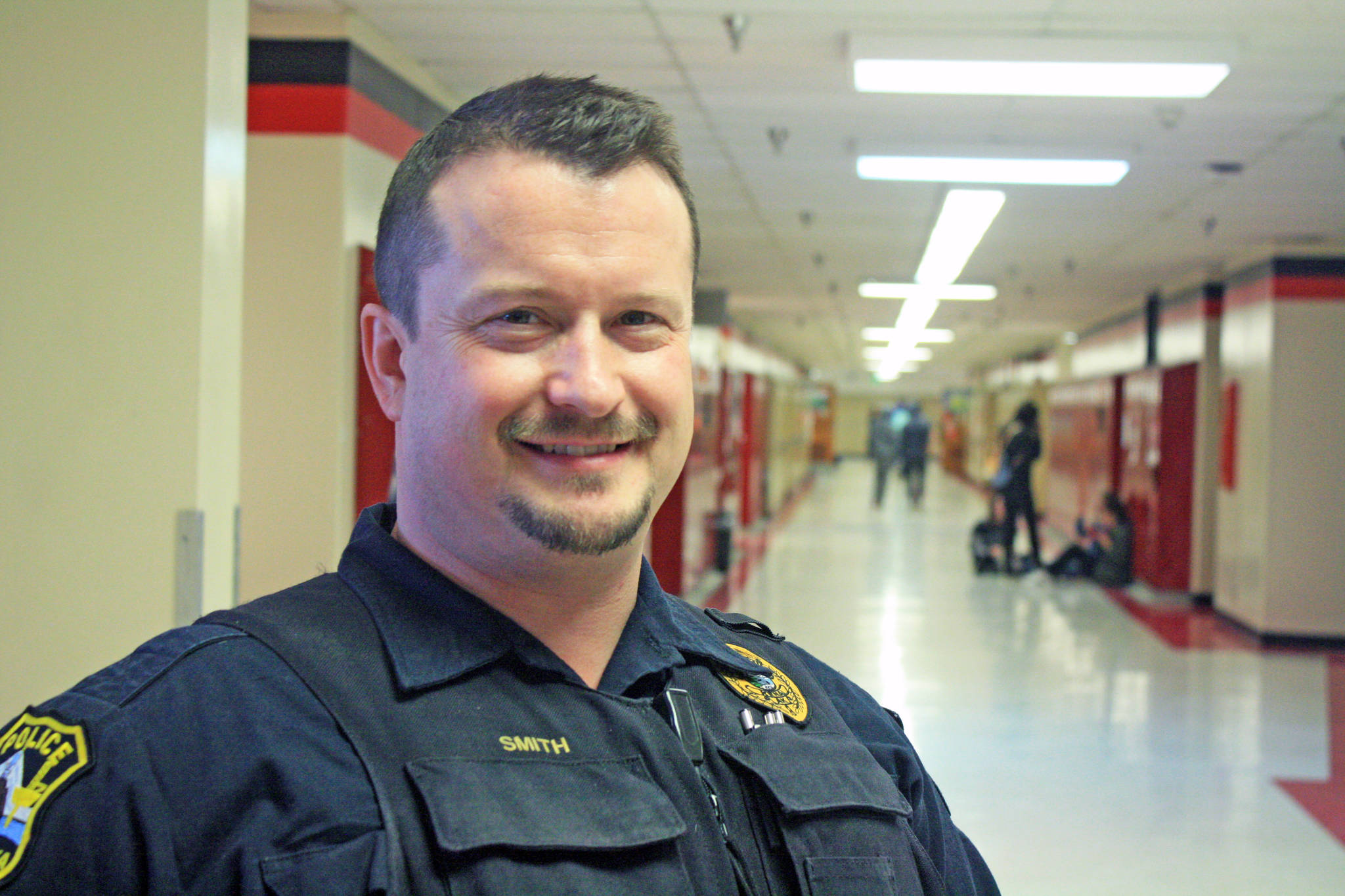 Kenai Police Officer Dan Smith, school resource officer and investigator, at Kenai Central High School on March 5. Smith acts as a liaison between law enforcement and the schools. (Photo by Erin Thompson/Peninsula Clarion)