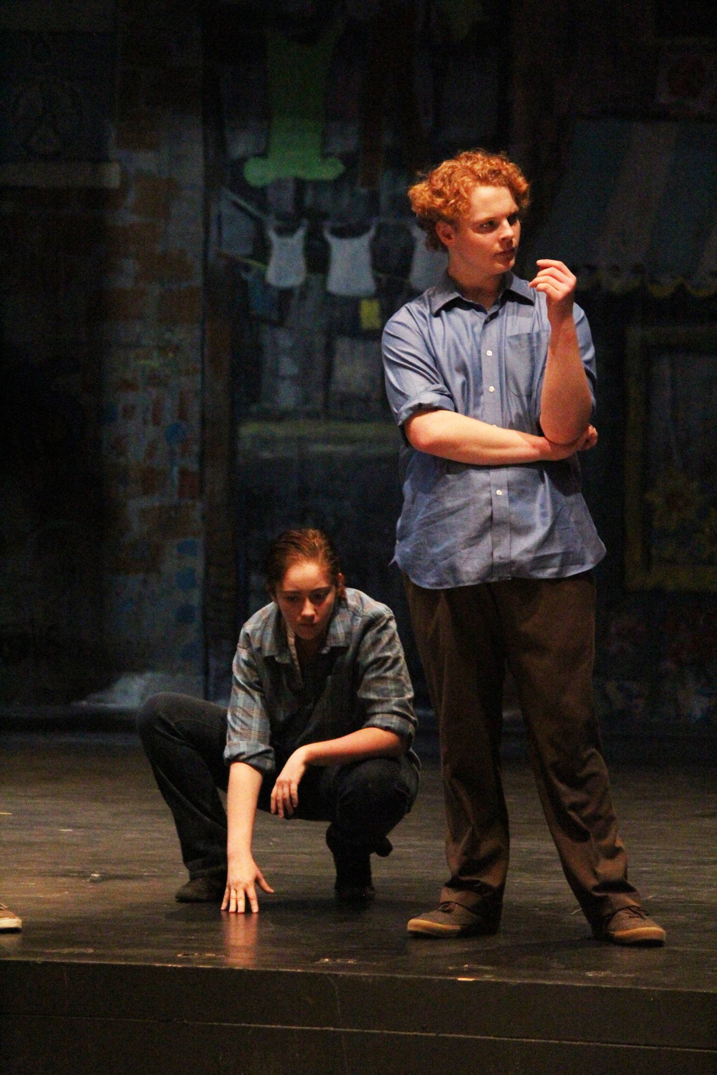 Homer High School students Marissa Geissler (let) and Theodore Castellani, as Riff, perform a scene from “West Side Story” during a dress rehearsal Tuesday, March 20, 2018 at the Mariner Theatre in Homer, Alaska. The musical is this year’s production for the school’s Concert Choir class, and and was last performed by the high school 15 years ago. (Photo by Megan Pacer/Homer News)