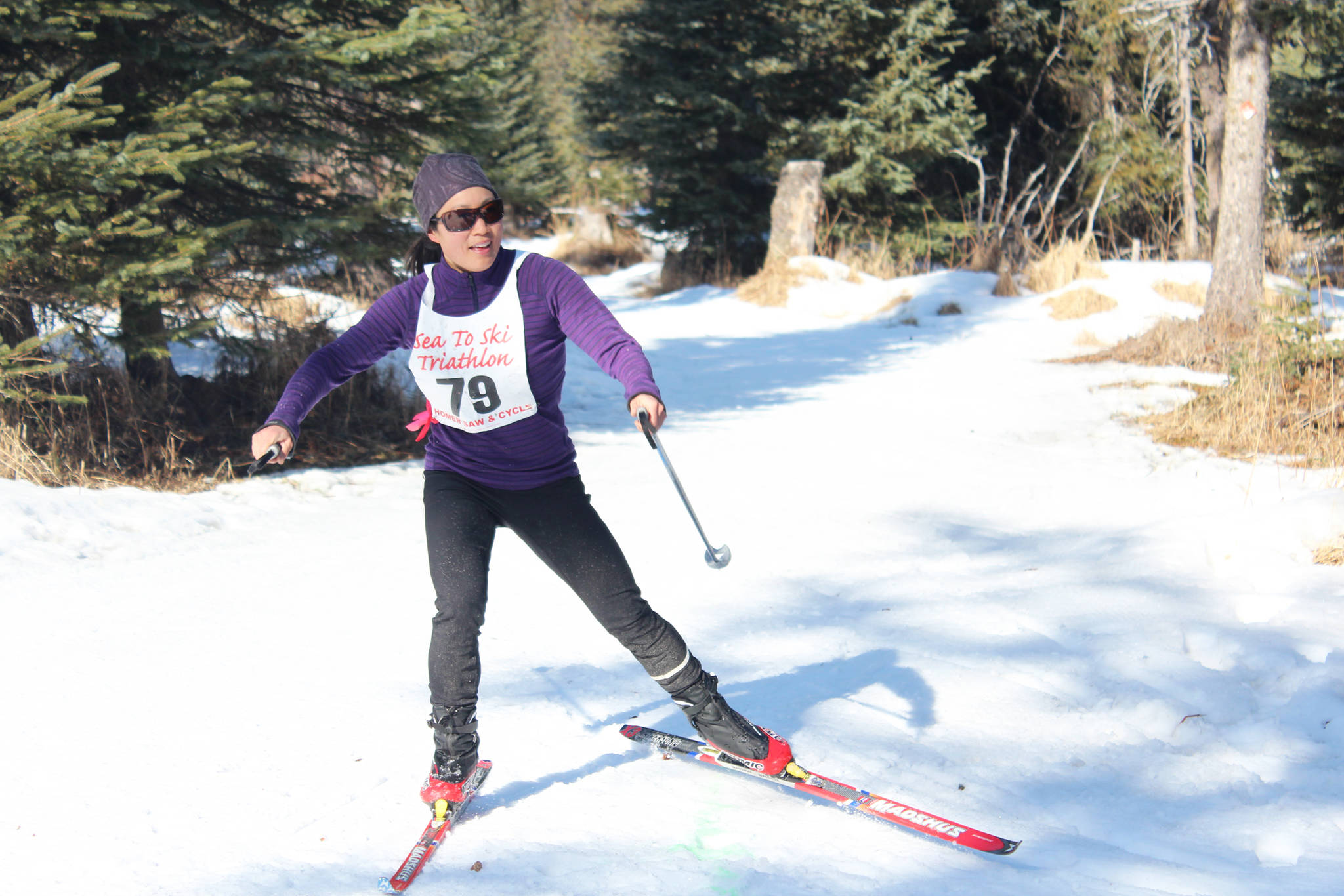 Jennifer Bando skis to the finish line of this year’s Sea to Ski Triathlon at the Roger’s Loop Trailhead on Sunday, March 25, 2018 in Homer, Alaska. Bando finished first for the female individual participants with a time of 1 hour, 17 minutes, 48 seconds. (Photo by Megan Pacer/Homer News)