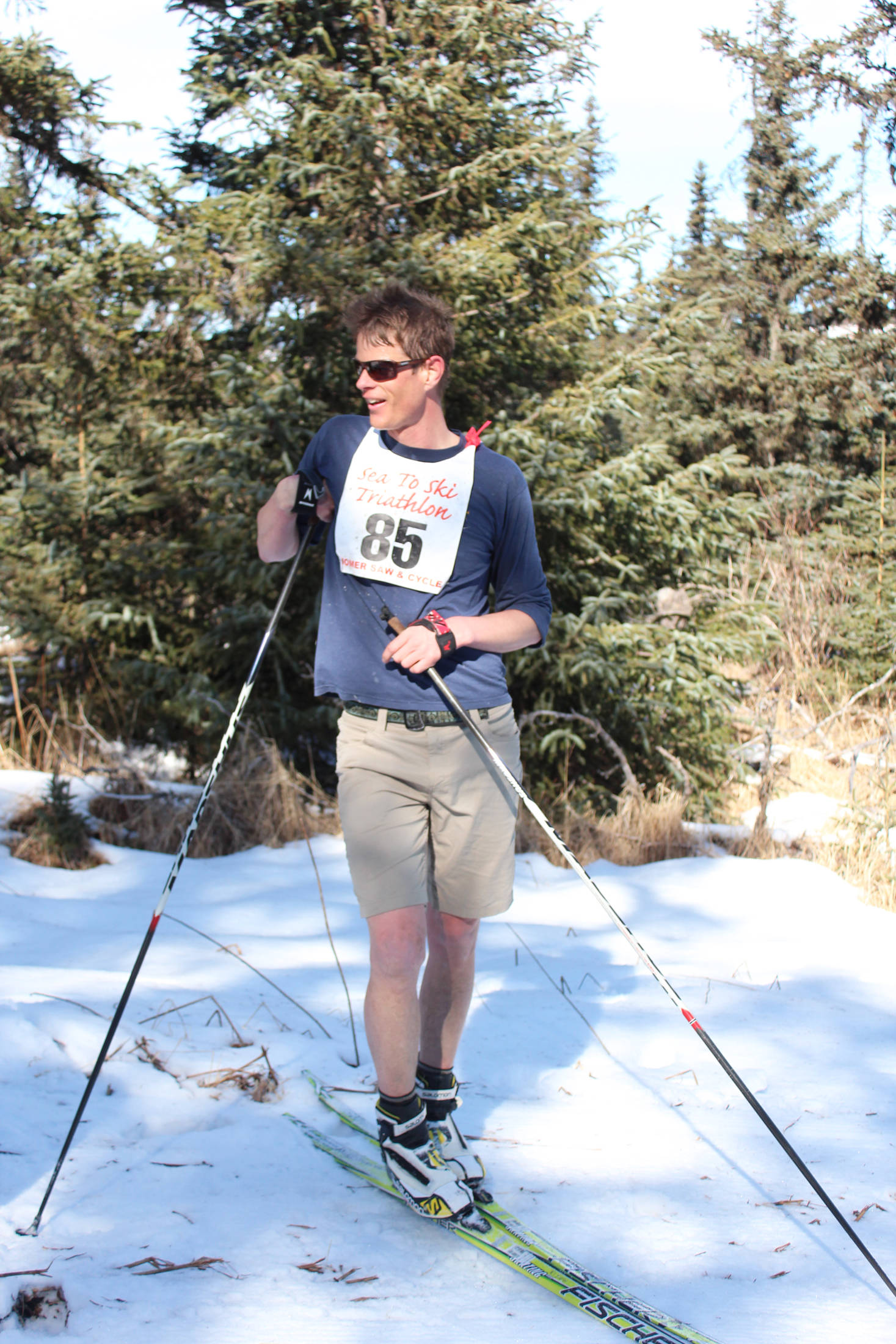 Josh Mumm relaxes after finishing the Sea to Ski Triathlon in second place as an individual racer with a time of 1 hour, 5 minutes, 59 seconds, a mere four seconds behind winner Denver Waclawski. Participants finished the race at the Roger’s Loop Trailhead off Highland Drive on Sunday, March 25, 2018 in Homer, Alaska. (Photo by Megan Pacer/Homer News)
