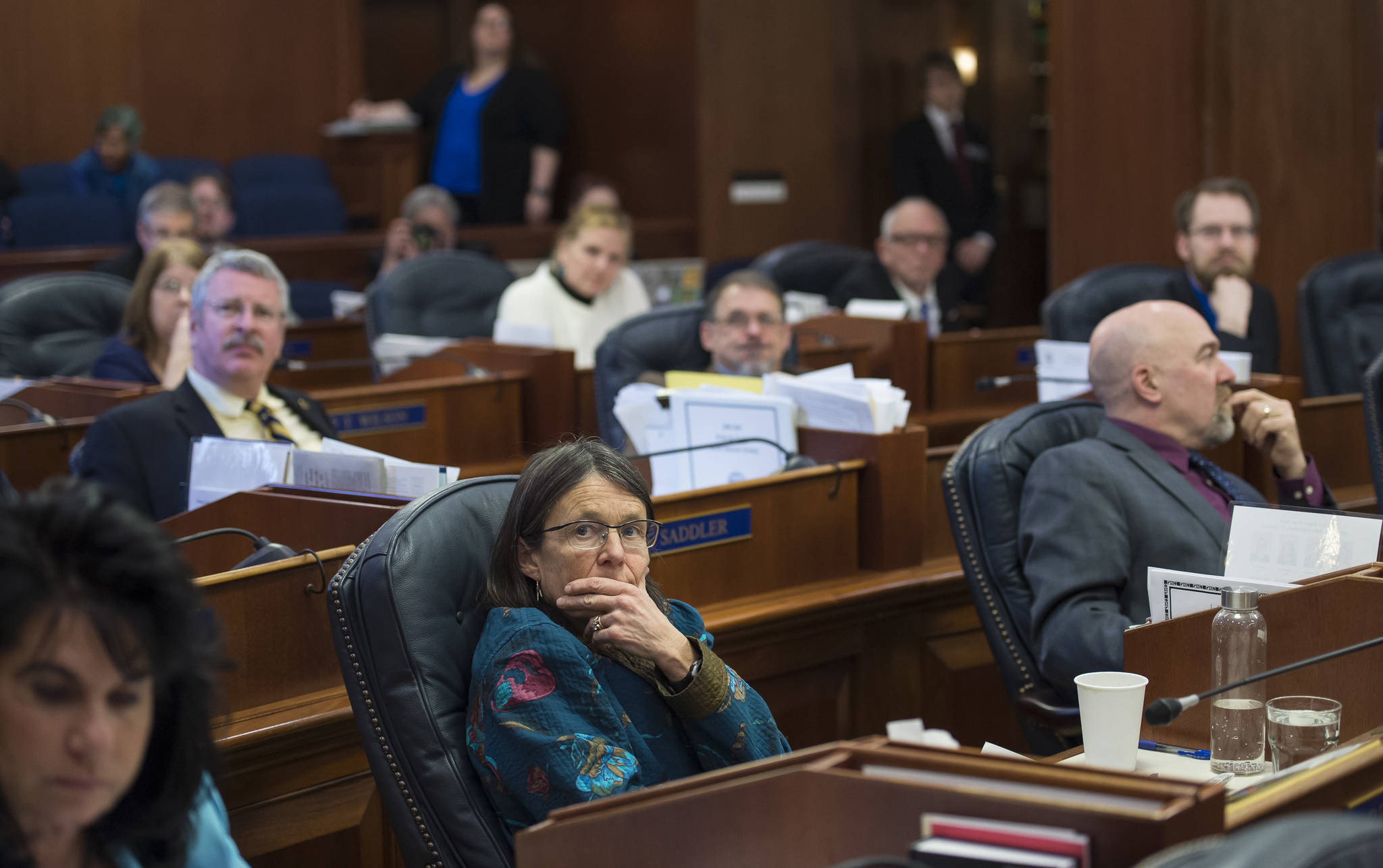 Members of the House of Representatives watch the vote on the state’s operating budget bill at the Capitol on Monday, April 2, 2018. The House passed the bill along caucus lines. (Michael Penn