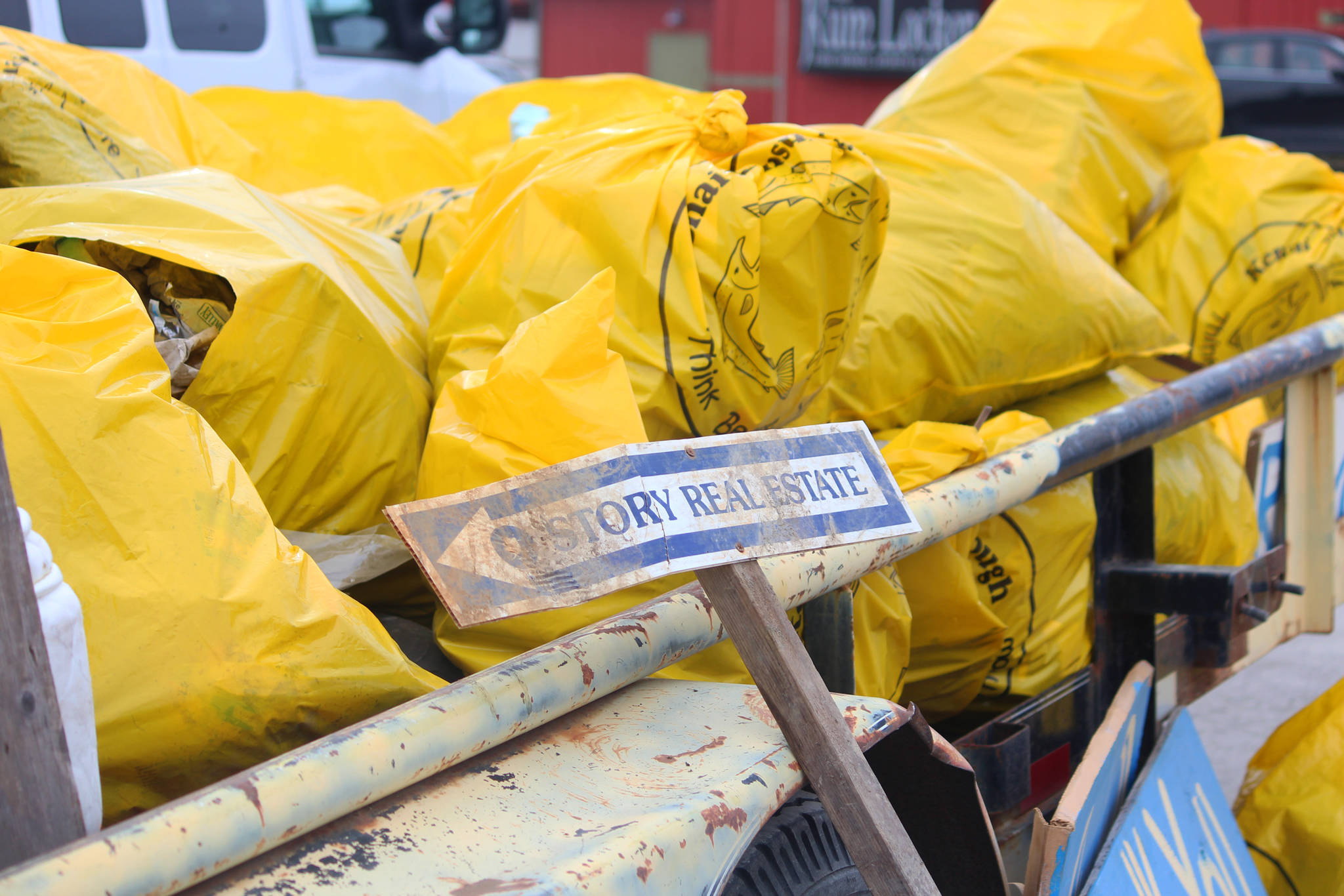 Bags of trash fill a trailer in the parking lot of the Homer Chamber of Commerce shortly after a clean-up effort Tuesday, April 17, 2018 in Homer, Alaska. Homer Wilderness Leaders is hosting a week of two-hour sessions to help clean up the town, which will culminate in a celebration at Alice’s Champagne Palace on Saturday. (Photo by Megan Pacer/Homer News)