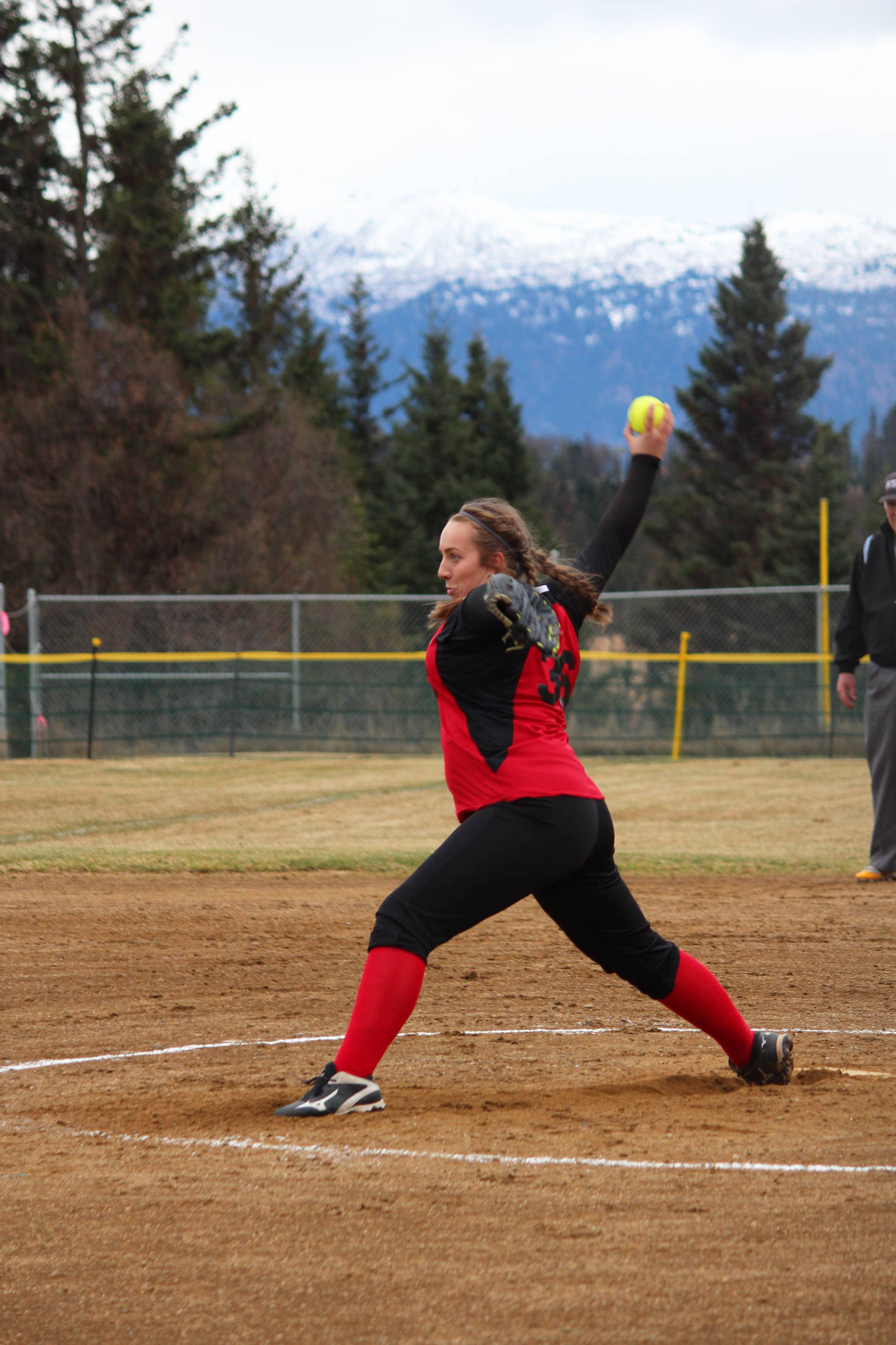 Kenai Central High School’s Savannah J …? pitches the ball during the team’s game against Homer High School on Tuesday, May 8, 2018 in Jack Gist Park in Homer, Alaska. (Photo by Megan Pacer/Homer News)