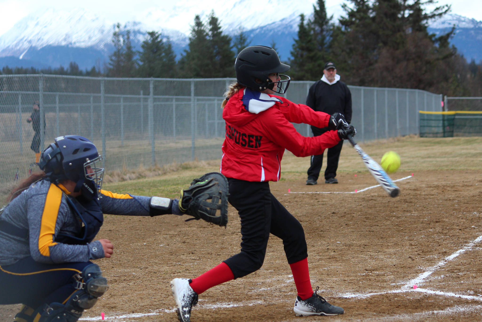 Kenai’s Zaharah Wibhusen hits the ball during the Kardinals’ softball game against Homer High School on Tuesday, May 8, 2018 in Jack Gist Park in Homer, Alaska. (Photo by Megan Pacer/Homer News)