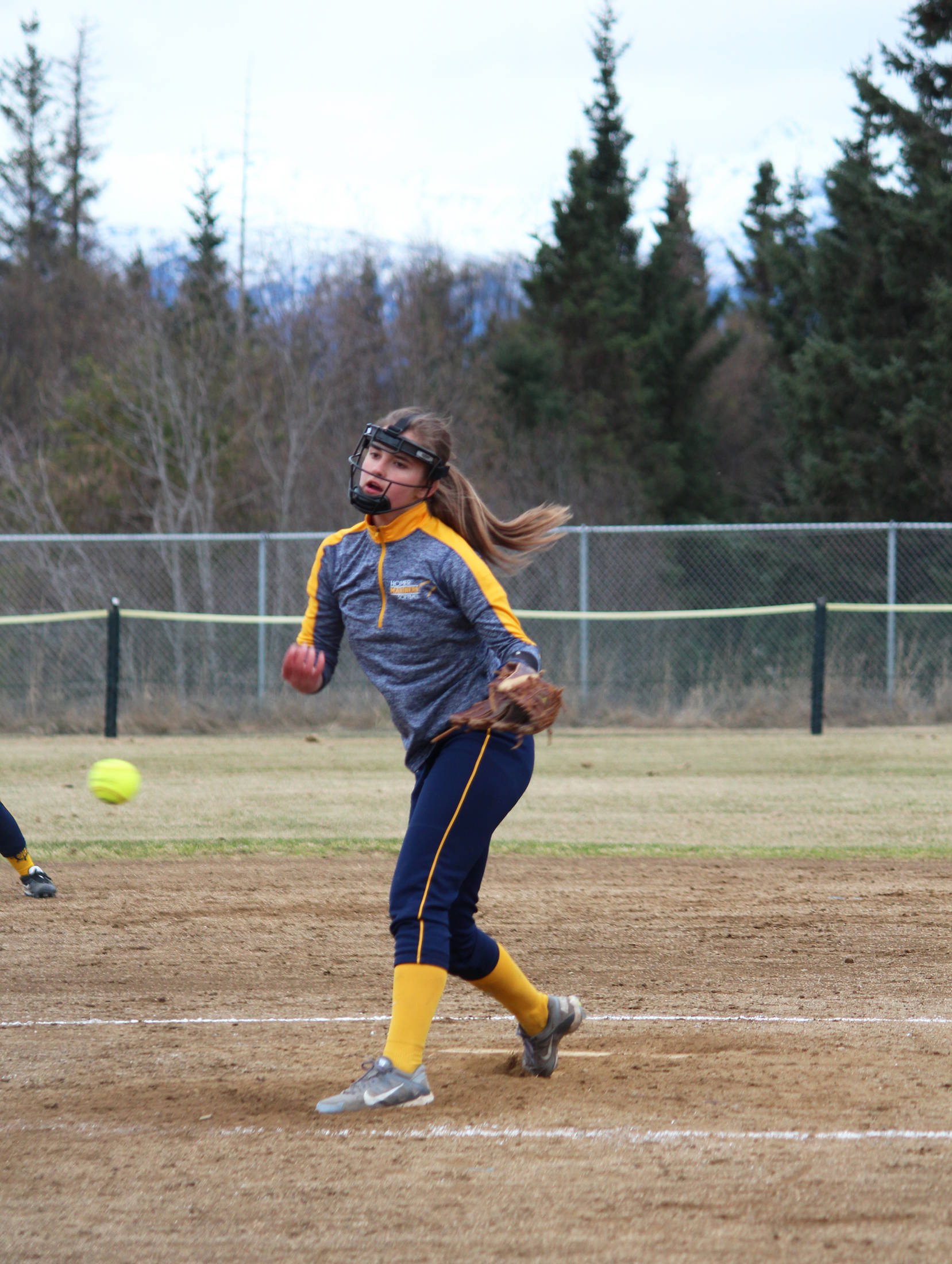 Photo by Megan Pacer/Homer News Homer’s Annalynn Brown pitches the ball during the Homer High School softball team’s game against Kenai Central High School Tuesday at Jack Gist Park in Homer.