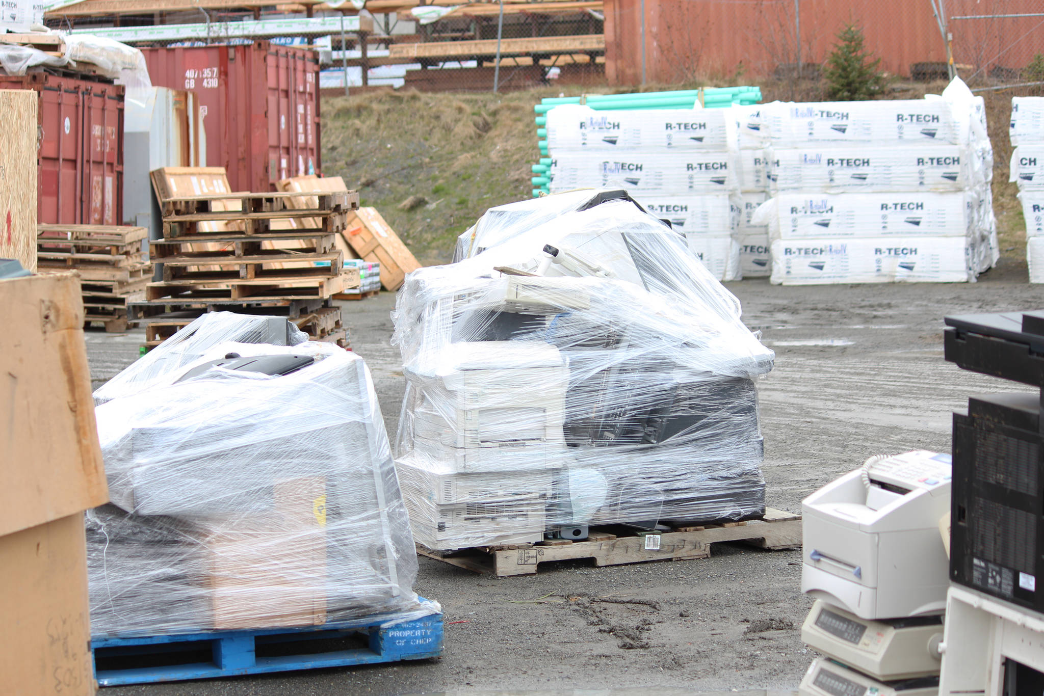 Pallets topped with wrapped electronics sit waiting to be shipped to Anchorage and Seattle for recycling during Cook Inletkeeper’s annual electronics recycling event Saturday, May 5, 2018 behind Spenard Builders Supply in Homer, Alaska. (Photo by Megan Pacer/Homer News)