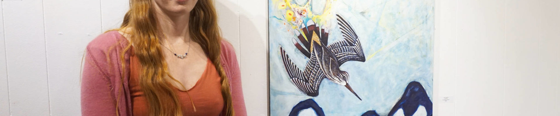Erin Rae D&rsquo;Eimon stands by one of her paintings at the First Friday opening for her show on May 4, 2018 at the Homer Council on the Arts in Homer, Alaska. (Photo by Michael Armstrong/Homer News)