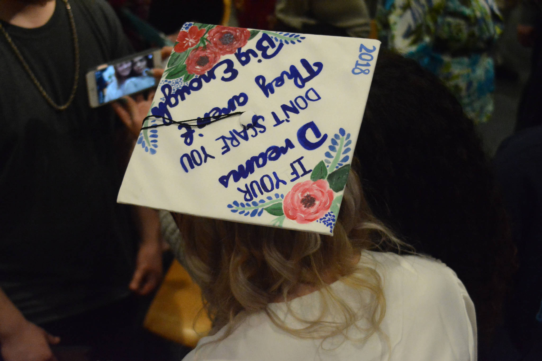 Flex High School graduate Amber Bridgeman’s mortarboard reads “If your dreams don’t scare you they’re not big enough.” Nine students graduated from Flex on Tuesday night, May 22, 2018, at the Alaska Islands and Ocean Visitor Center auditorium, Homer, Alaska. (Photo by Michael Armstrong / Homer News)