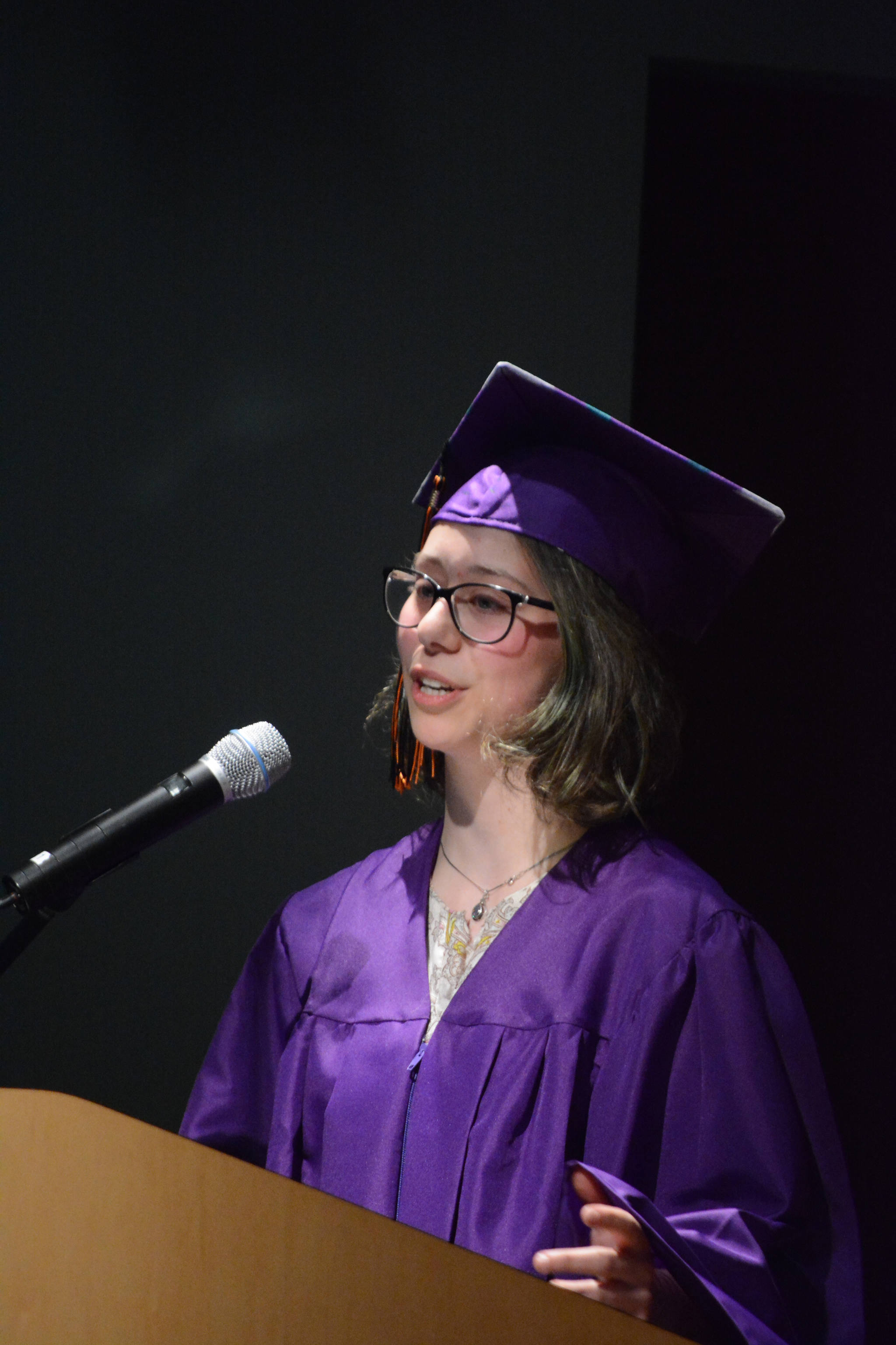 Flex High School graduate Zoe Cramer gives a speech thanking family, friends, teachers and staff, Cramer said, “Mistakes don’t have to be a downfall. They are the soil from which we grow.” Nine students graduated from Flex on Tuesday night, May 22, 2018, at the Alaska Islands and Ocean Visitor Center auditorium, Homer, Alaska. (Photo by Michael Armstrong / Homer News)