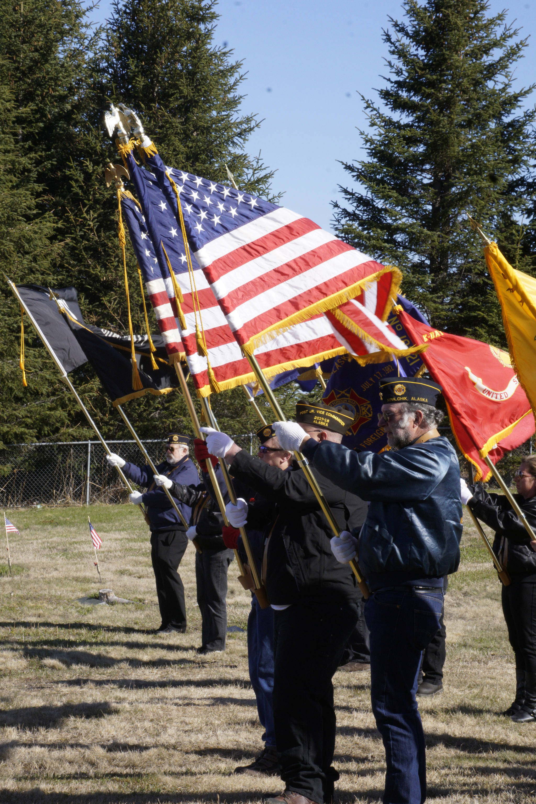Members of the American Legion and the Veterans of Foreign Wars hold flags on Memorial Day, May 28, 2018, at Hickerson Memorial Cemetery, Homer, for services there. (Photo by Michael Armstrong / Homer News)