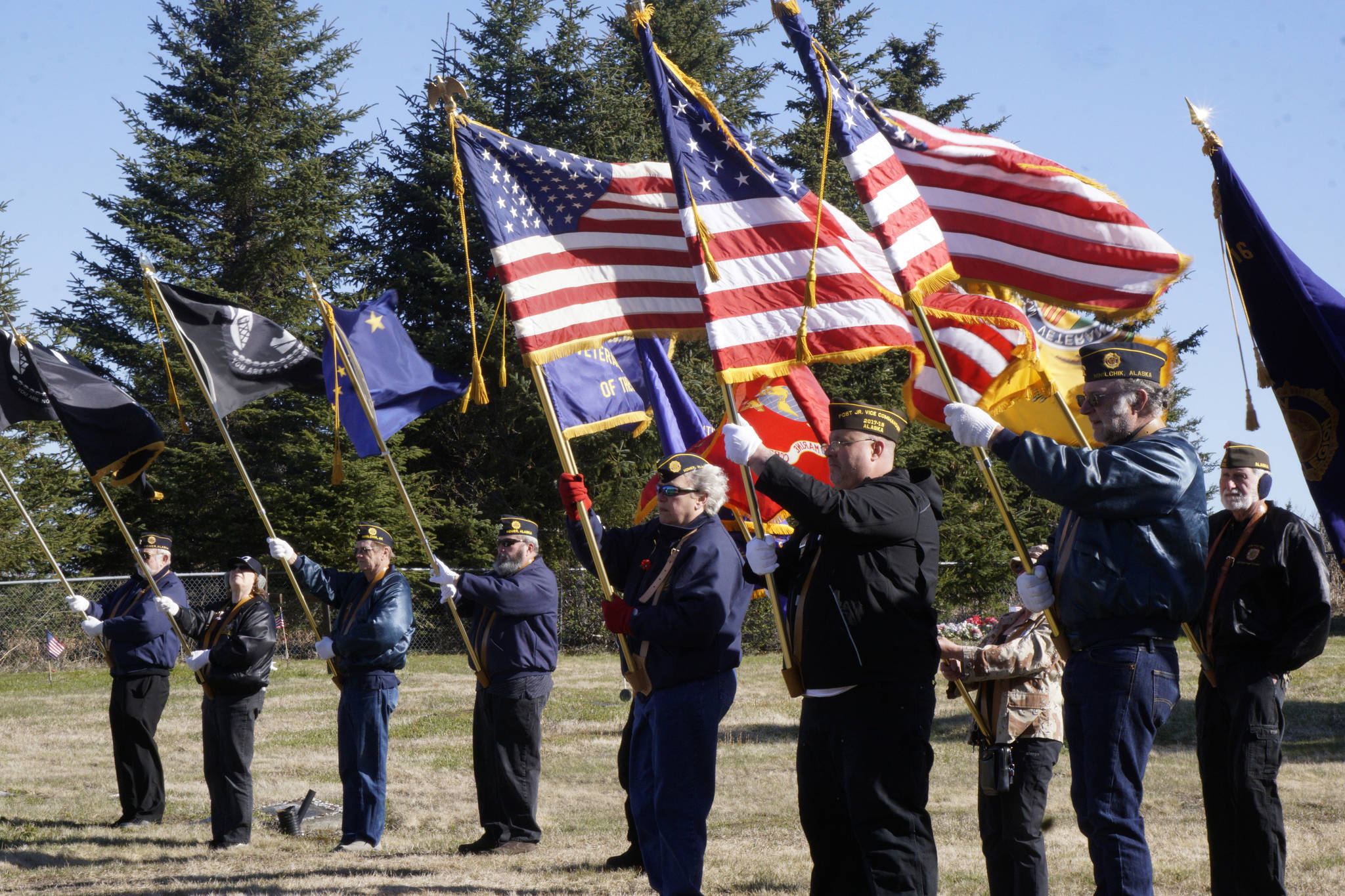 Members of the American Legion and the Veterans of Foreign Wars hold flags on Memorial Day, May 28, 2018, at Hickerson Memorial Cemetery, Homer, for services there. (Photo by Michael Armstrong / Homer News)