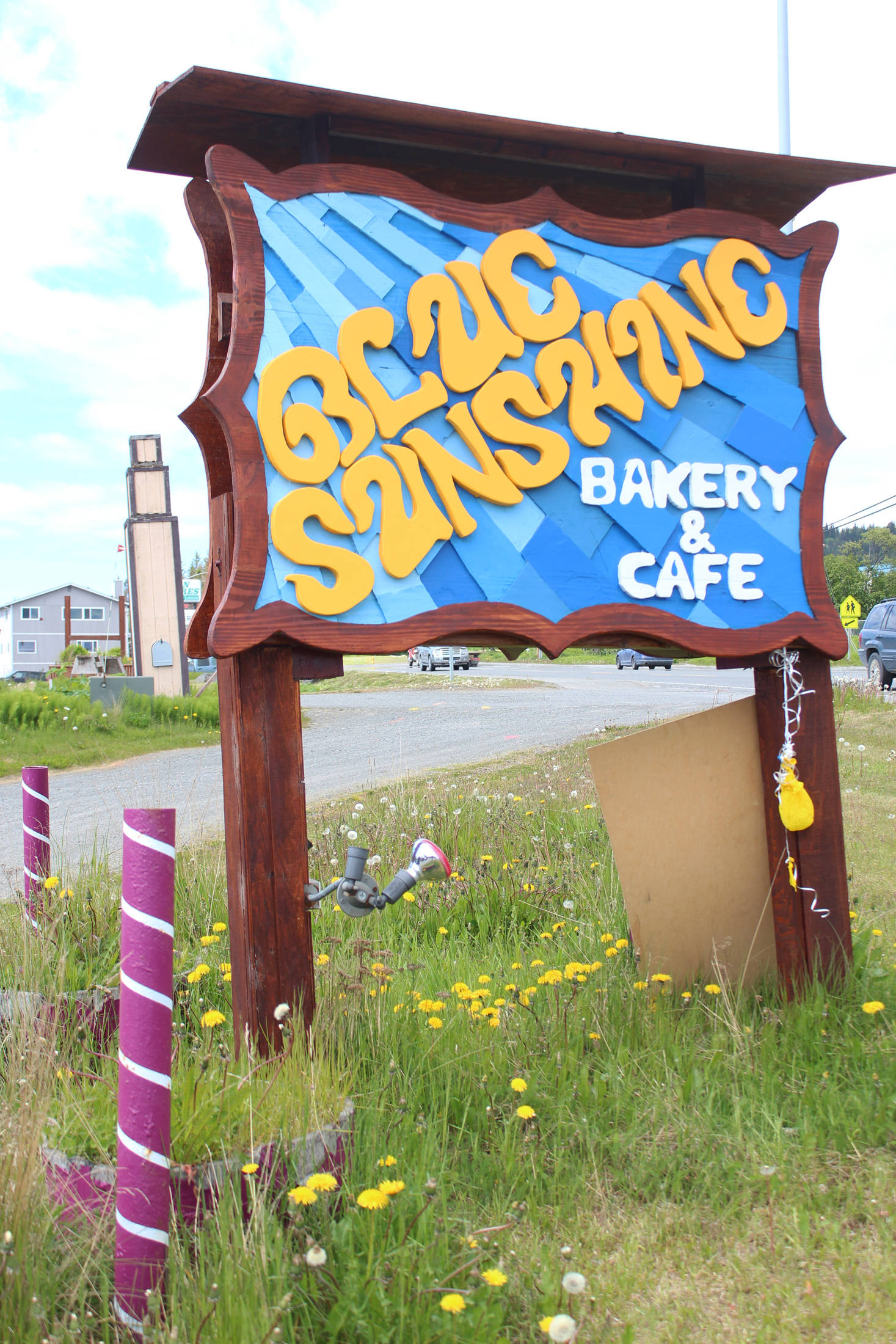 A new sign announces the presence of Blue Sunshine Bakery and Cafe on Tuesday, June 12, 2018 on the Sterling Highway in Homer, Alaska. (Photo by Megan Pacer/Homer News)