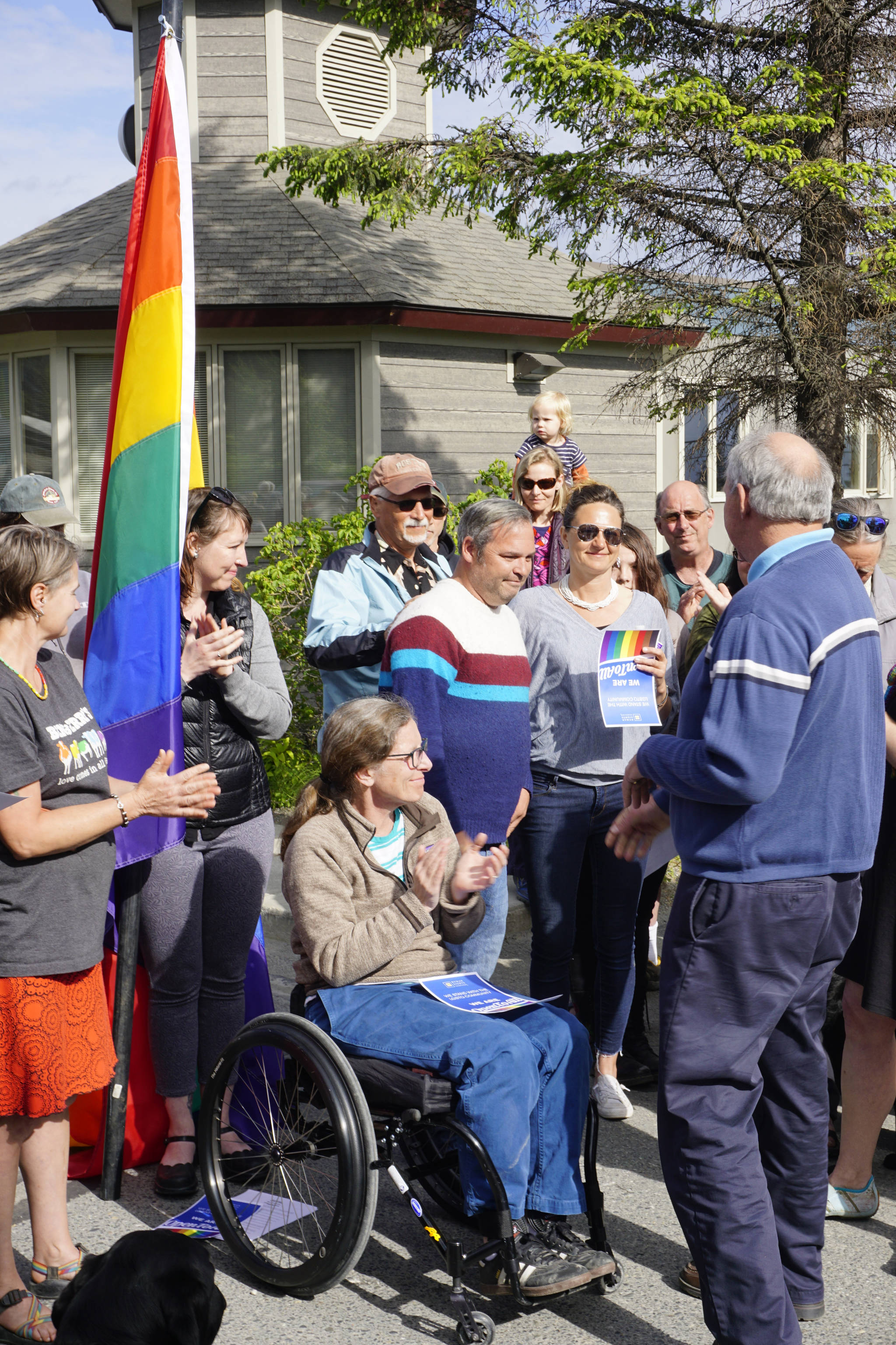 Homer Mayor Bryan Zak greets people after reading a Mayoral Recognition recognizing June as Homer Pride Month at about 6 p.m. Monday, June 11, 2018 outside Homer City Hall in Homer, Alaska. A crowd of about 75 people attended in support of Pride Month. Council members Shelly Erickson, Heath Smith and Thomas Stroozas notified the city clerk that they would not attend the June 11 meeting, forcing its cancellation because of lack of a quorum. (Photo by Michael Armstrong/Homer News)