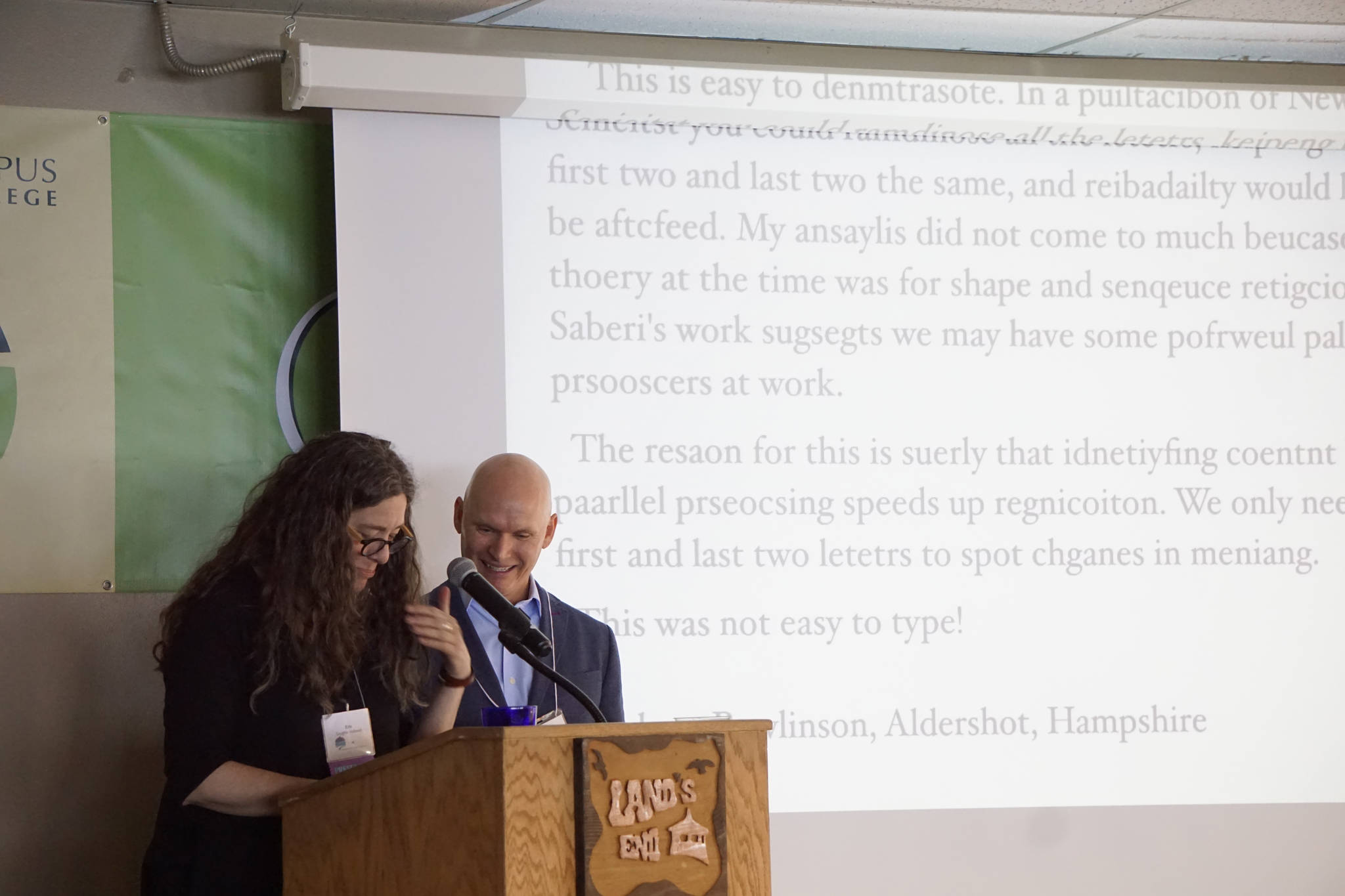 Homer poet and Kachemak Bay Writers’ Conference faculty member Erin Coughlin Holliwell, left, reads a passage that shows words can be understood even when the letters are garbled as keynote speaker Anthony Doerr watches. Doerr delivered the opening address at the start of the annual conference last Friday, June 5, at Land’s End Resort. (Photo by Michael Armstrong/Homer News)