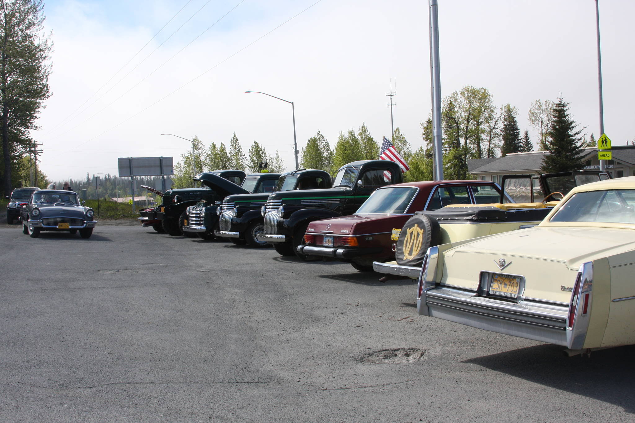 A line of classic cars from local owners and Kaknu Kruzers is displayed at Thurmond’s Far West Auto during their fourth annual Customer Appreciation Day on Saturday, June 9 in Anchor Point, Alaska. (Photo by Delcenia Cosman)