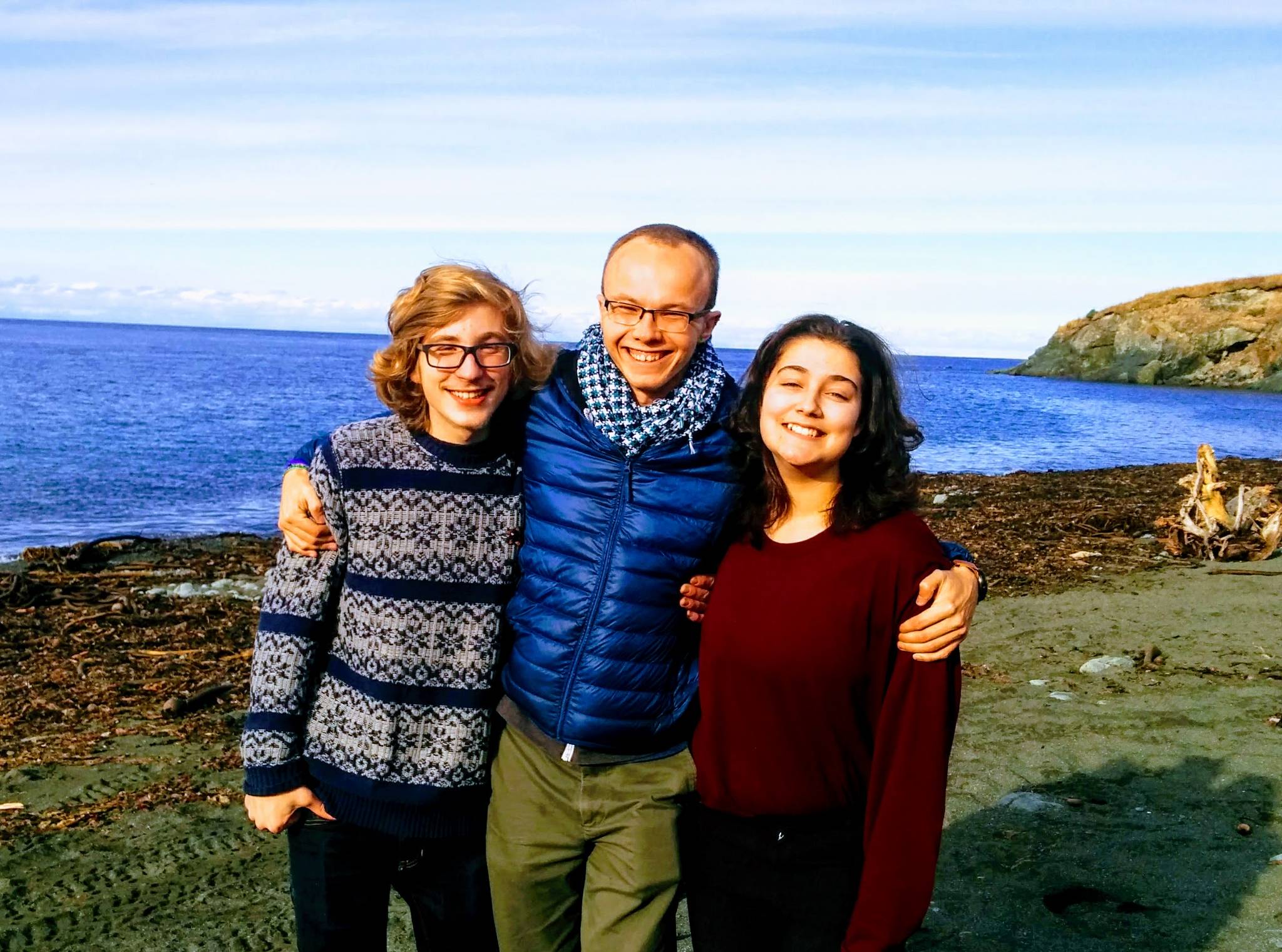 Parker Gibson, left, poses with REC Room staff member Connor Schmidt, center, and Chloë Pleznac, right, at Nanwalek in October 2017. (Photo provided, REC Room)