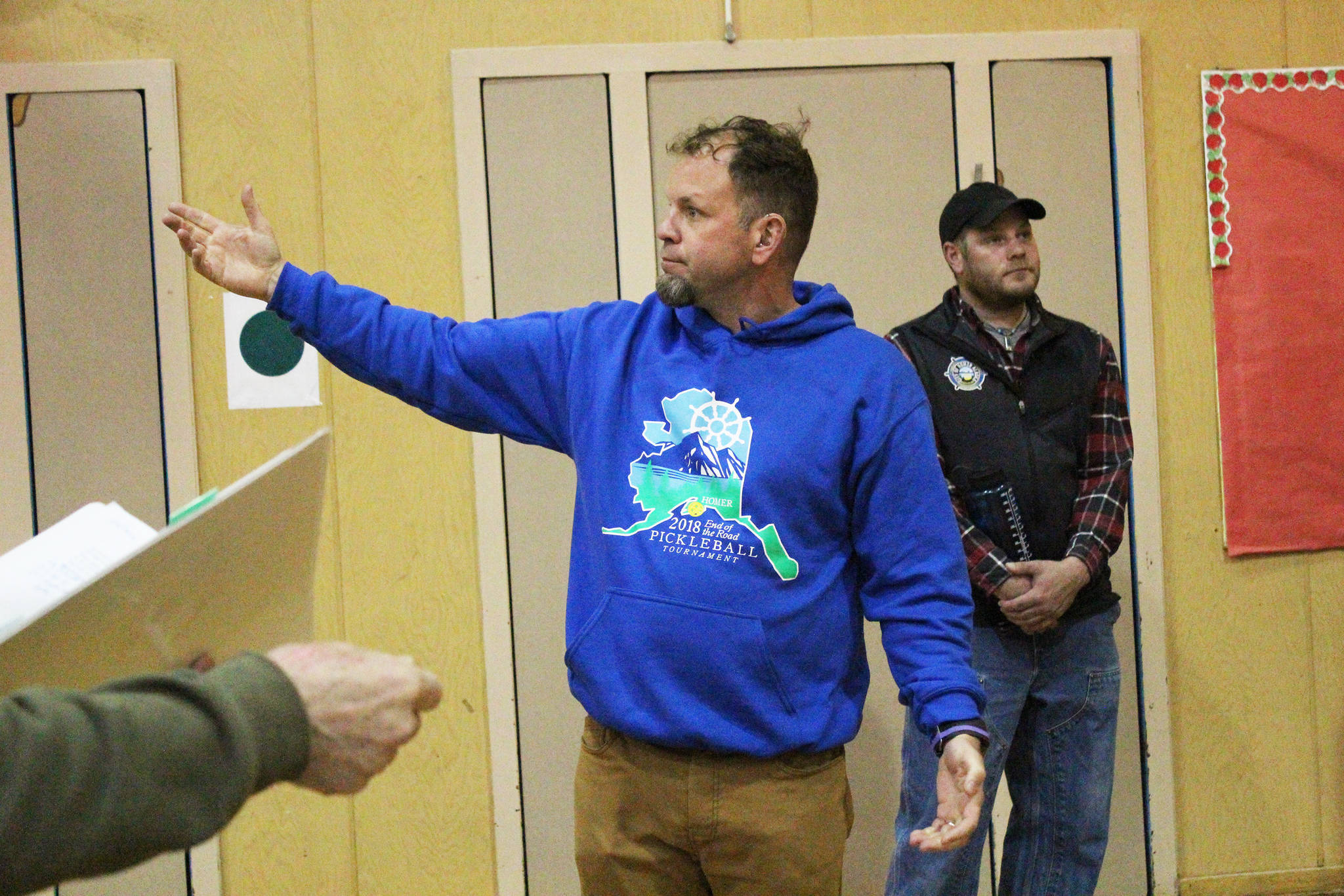 Homer Community Recreation Program Director Mike Illg describes the uses and capacities of the gymnasium inside one of the two Homer Education and Recreation Complex buildings during a walk-through Tuesday, June 26, 2018 in Homer, Alaska. Illg is also a member of the Parks, Art, Culture and Recreation Advisory Commission. The city’s HERC Task Force inspected the building along with members of the public while city staff answered questions about the two buildings’ history and current state. (Photo by Megan Pacer/Homer News)