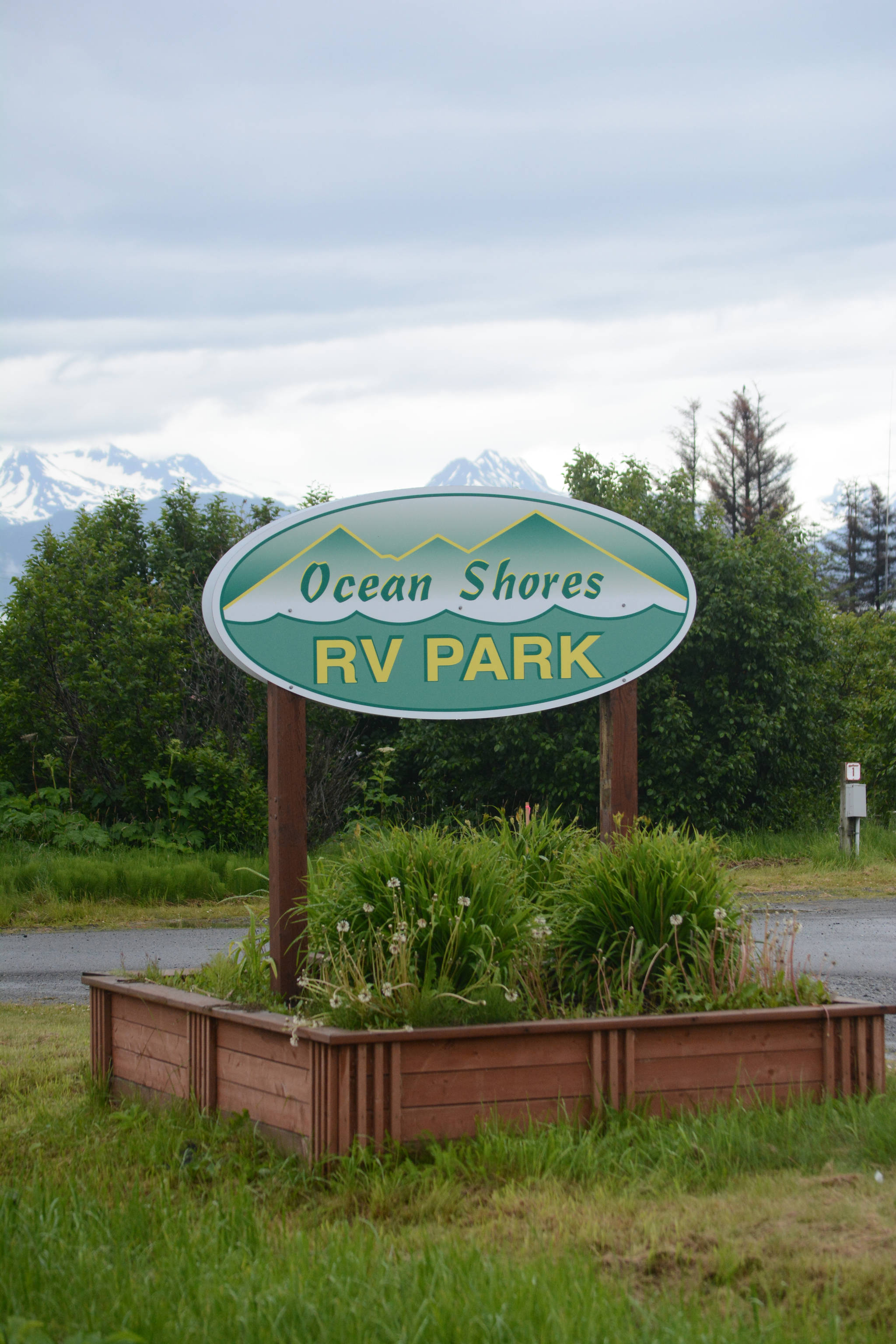 The sign for the Ocean Shores RV Park on the Sterling Highway, Homer, Alaska, as seen on June 29, 2018. The longtime campground formerly known as Ocean View RV Park reopened last month under its new owner, Michael Warburton, who also owns Ocean Shores Motel next door. (Photo by Michael Armstrong/Homer News)