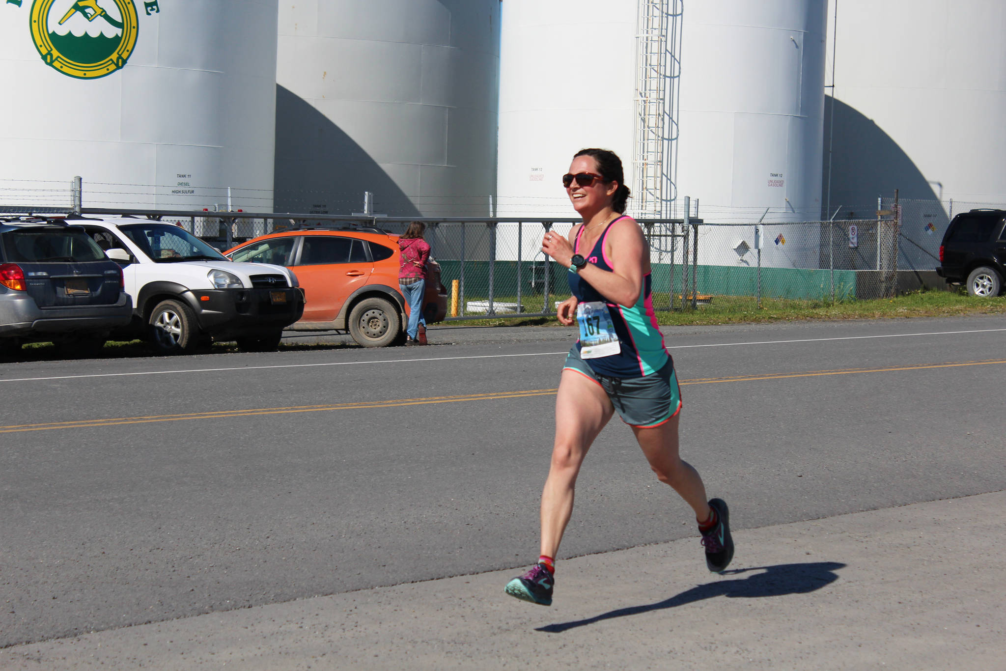 Homer’s Alayne Tetor runs the final stretch to the finish line of the Homer Spit Run on Saturday, June 30, 2018 at Land’s End Resort in Homer, Alaska. Tetor took third place in the Cosmic Hamlet Half Marathon for the women. (Photo by Megan Pacer/Homer News)