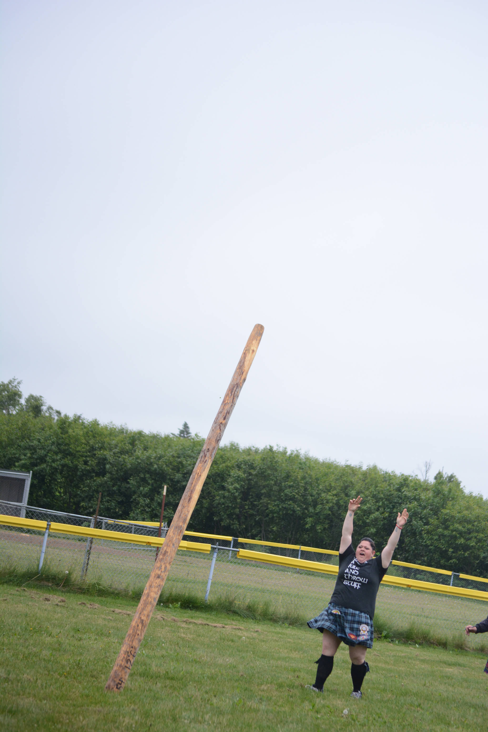 Jeni McDaniel flips the caber at the July 3, 2017 Kachemak Bay Scottish Club Highland Games on Saturday at Karen Hornaday Park. (Photo by Michael Armstrong/Homer News)
