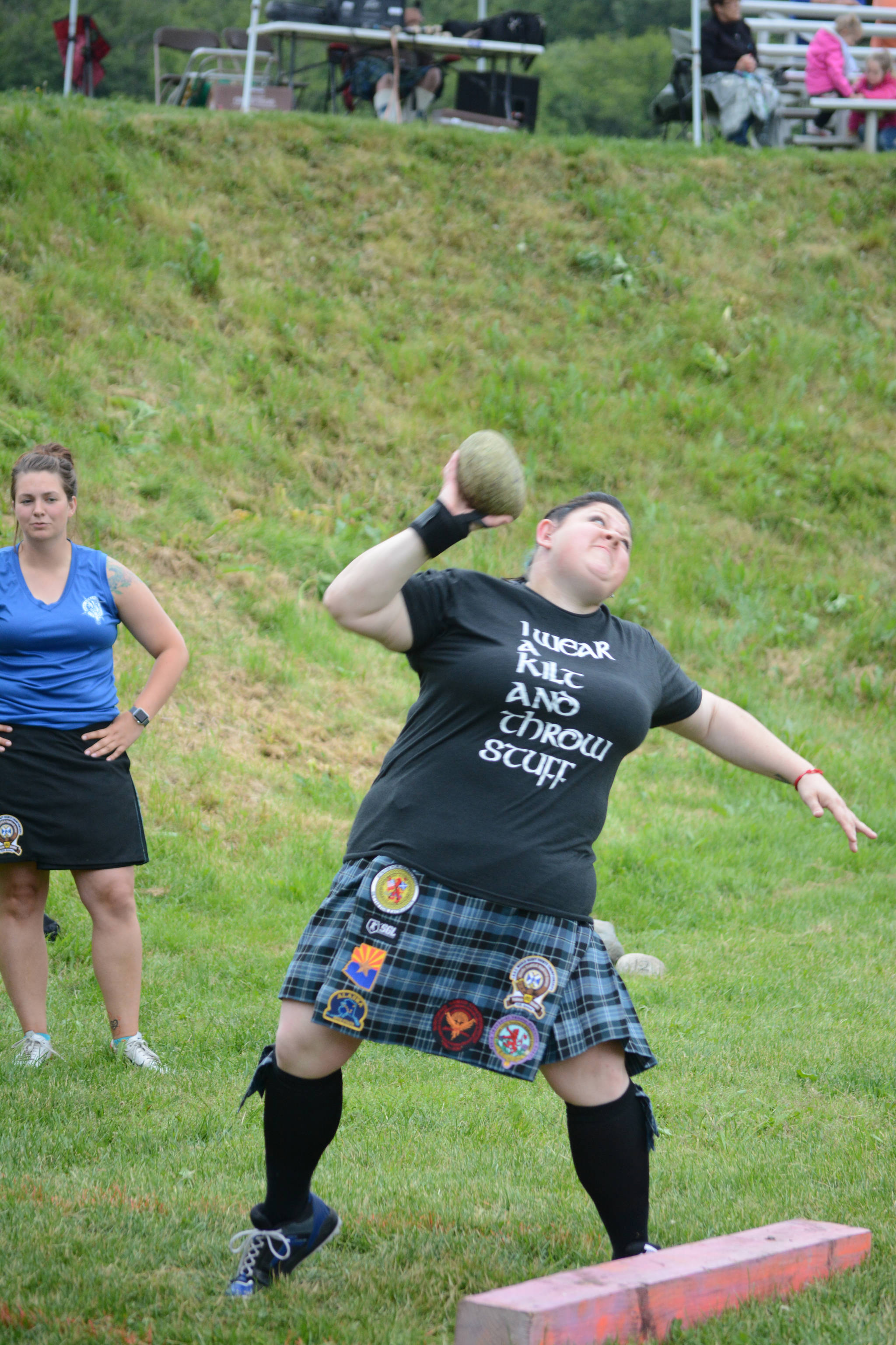 Jeni McDaniel throws the Braemar stone in the July 3, 2017 Kachemak Bay Scottish Club Games last Saturday at Karen Hornaday Park. (Photo by Michael Armstrong/Homer News)