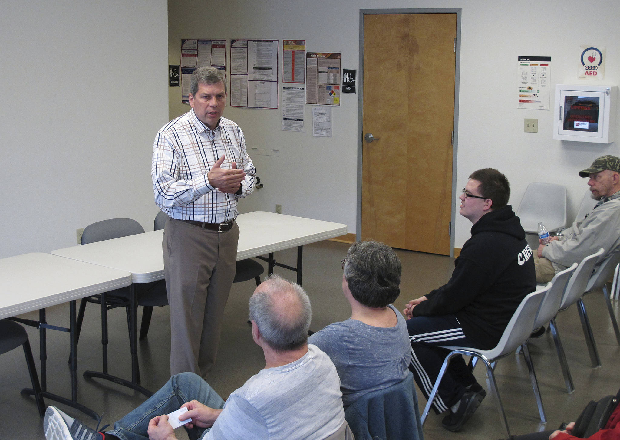 In this June 28, 2018, photo, Democrat Mark Begich, a candidate for governor in Alaska and a former U.S. senator, speaks during a meet-and-greet event at a labor hall in Juneau, Alaska. Begich is seeking to ease concerns some have about his entry into the race, saying he would not be running if he did not think he could win. The race is shaping up to be a three-way, general election contest between Begich, independent Gov. Bill Walker and the eventual Republican nominee. (AP Photo/Becky Bohrer)