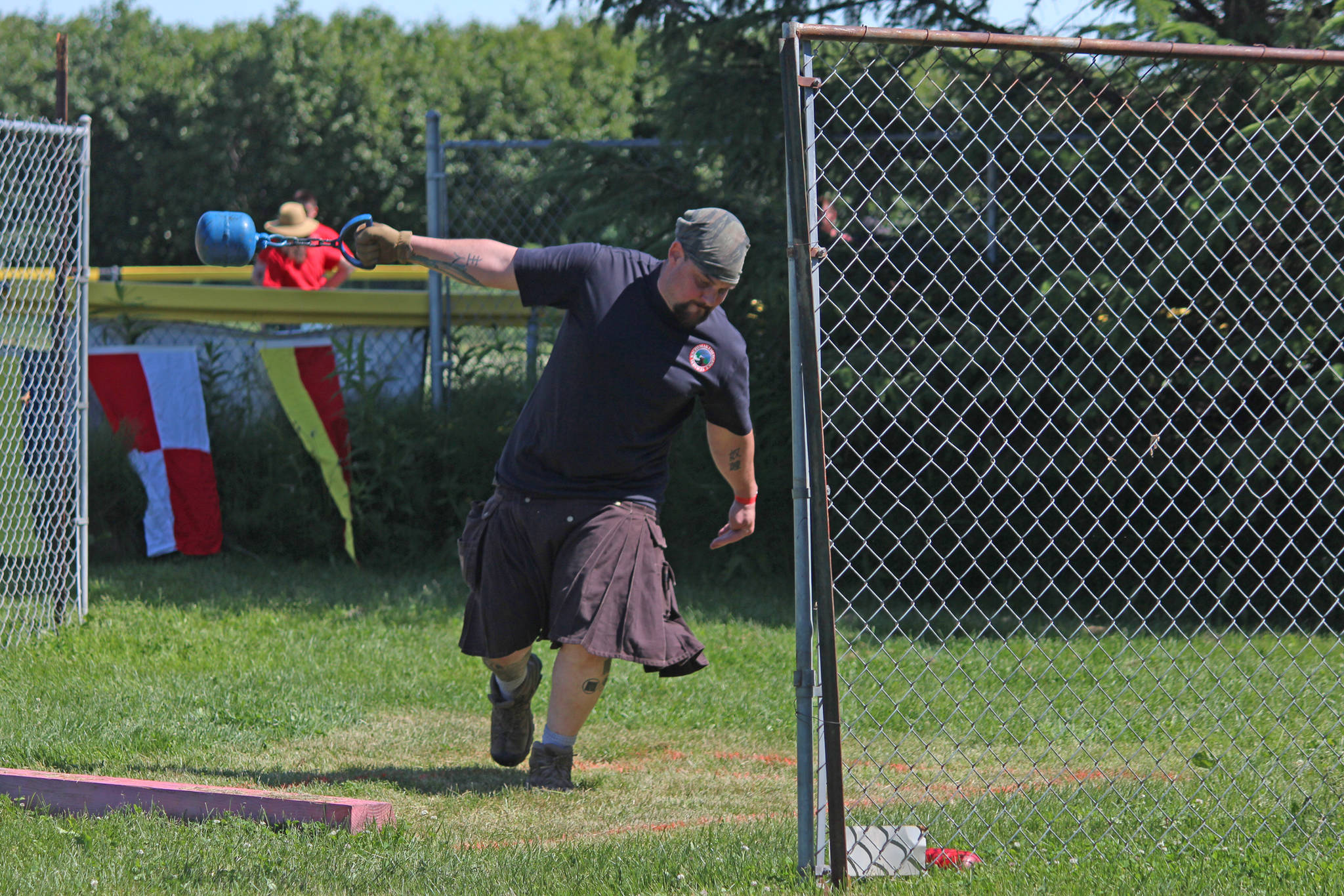 Travis Ogden prepares to throw a weight in the weight throw for distance competition Saturday, July 7, 2017 at the Kachemak Bay Scottish Highland Games at Karen Hornaday Park in Homer, Alaska. Ogden is a firefighter and EMT 2 medic for Kachemak Emergency Services and the network security administrator for South Peninsula Hospital. (Photo by Megan Pacer/Homer News)