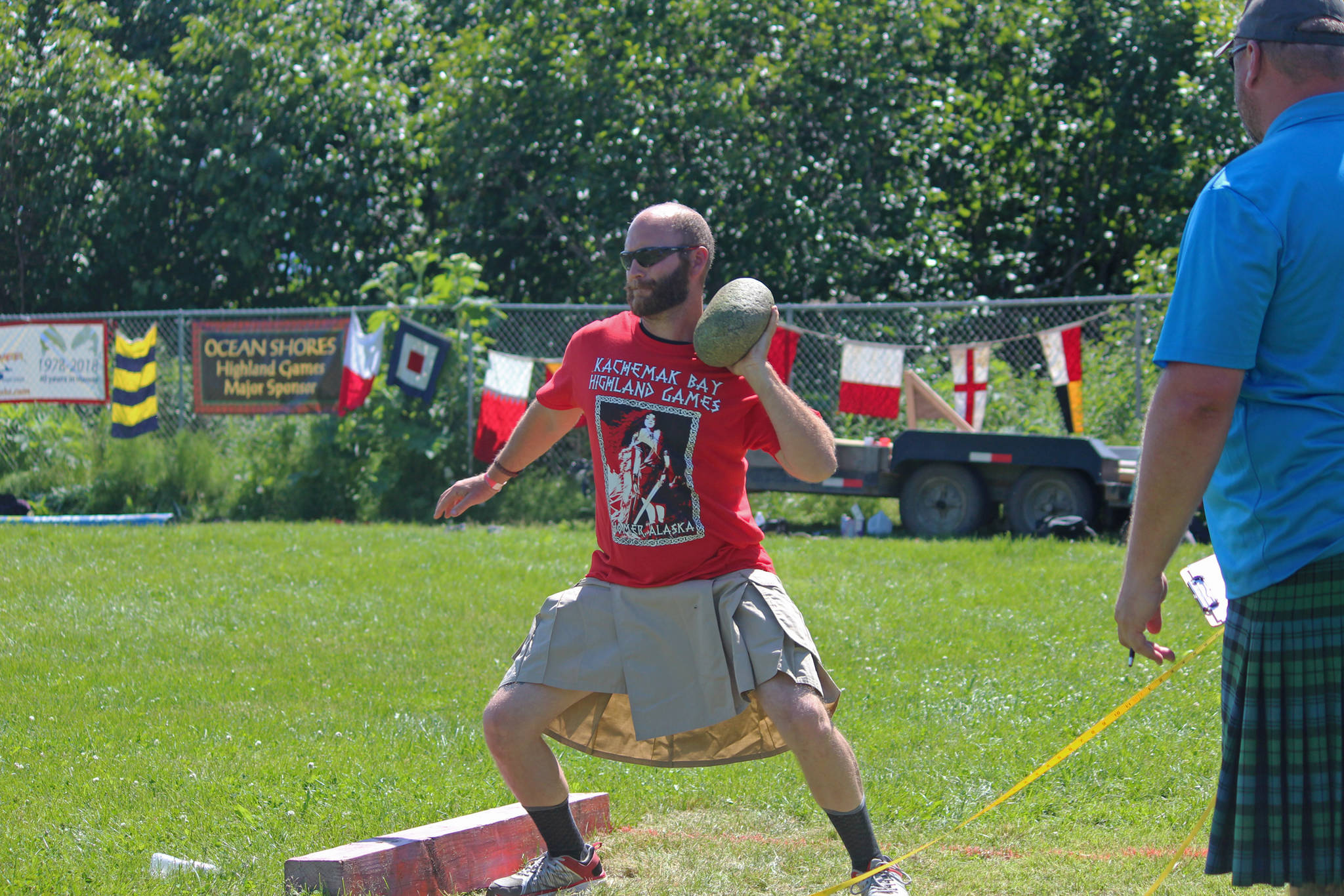 A novice competitor prepares to throw a braemar stone during the Kachemak Bay Scottish Highland Games on Saturday, July 7, 2018 at Karen Hornaday Park in Homer, Alaska. (Photo by Megan Pacer/Homer News)