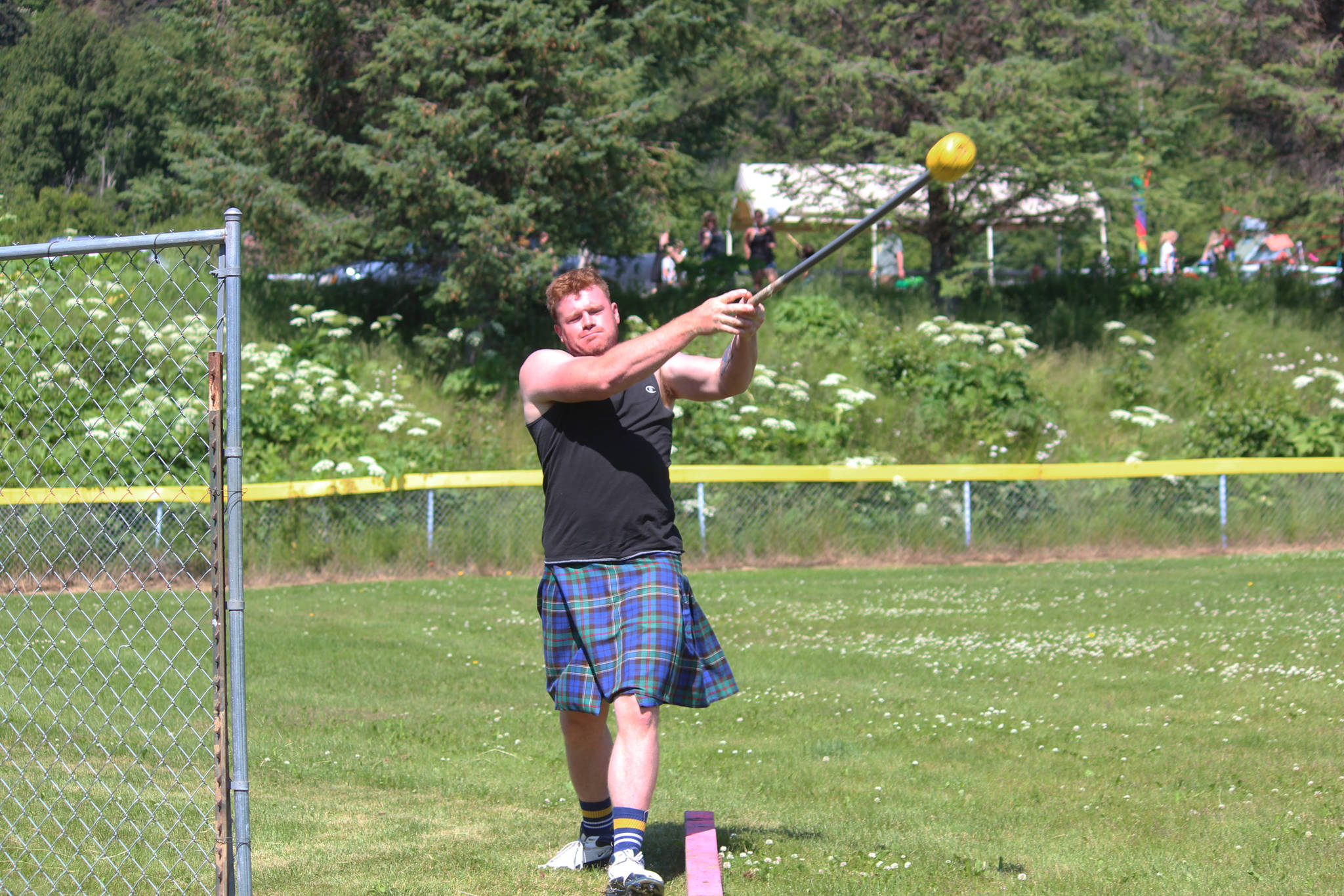 Zachary Fraley of Homer throws a hammer during the hammer throw portion of this year’s Kachemak Bay Scottish Highland Games on Saturday, July 7, 2018 at Karen Hornaday Park in Homer, Alaska. (Photo by Megan Pacer/Homer News)