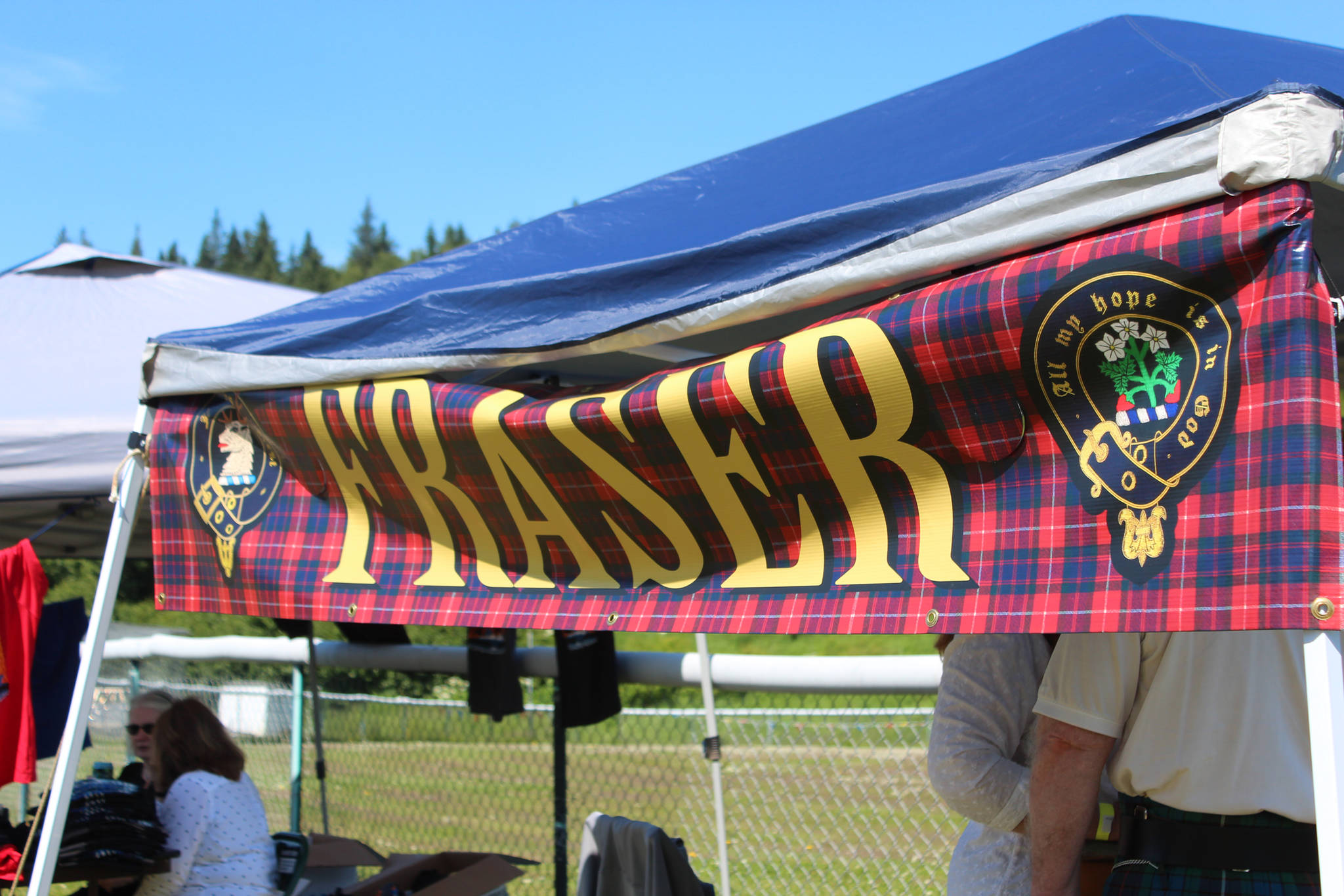 A clan booth advertises the Fraser clan at this year’s Kachemak Bay Scottish Highland Games on Saturday, July 7, 2018 at Karen Hornaday Park in Homer, Alaska. (Photo by Megan Pacer/Homer News)