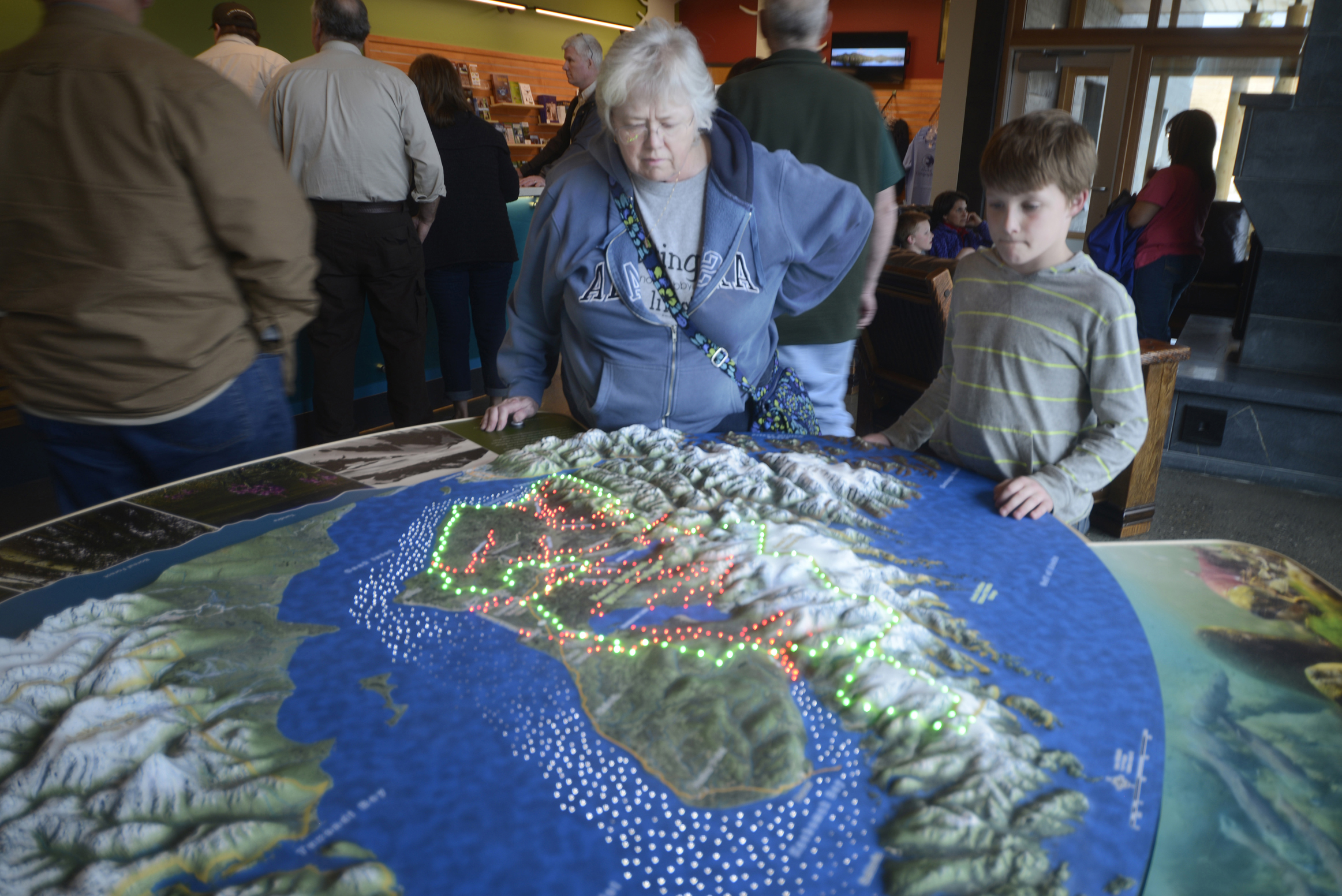 A display at the new Kenai Wildlife Refuge Visitor’s Center shows the Kenai Peninsula’s anadromous streams in red lights and the borders of the Kenai Wildlife Refuge in green. The new visitor center opened Friday in Soldotna.-Ben Boettger, Morris News Service - Alaska