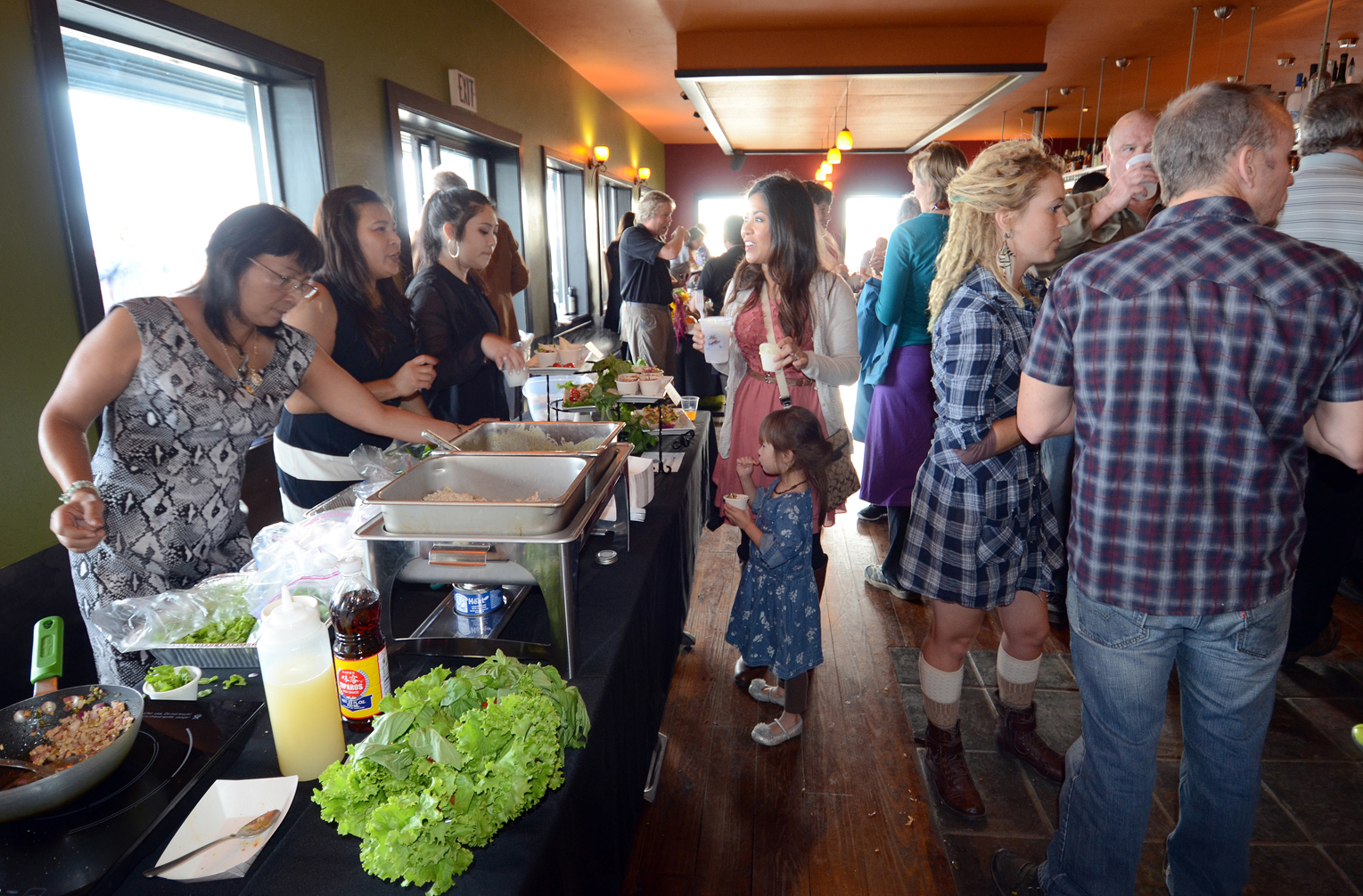 A variety of food and drink to please young and old palates is served and sampled Saturday during the second annual Taste of Homer. The event was again held at Wasabi’s.-Photo by Jim Lavrakas, Far North Photography