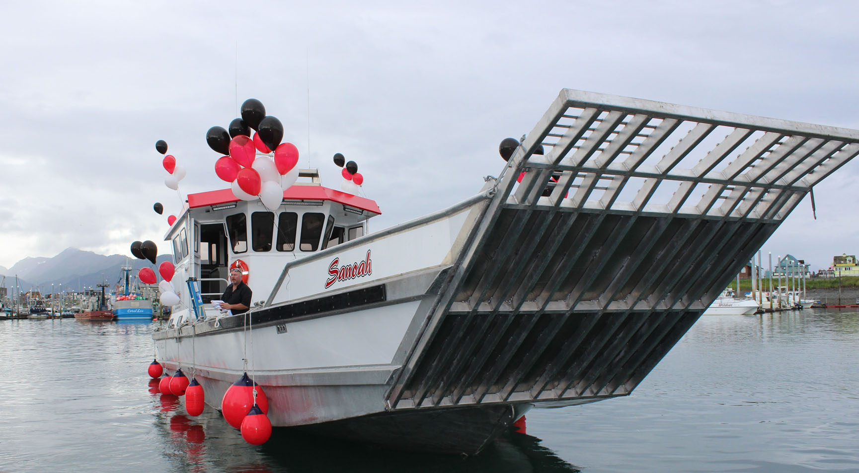 the 42-foot M/V Sanoah was decked out in balloons Sunday for a celebration of its christening. It also was owner Steve Attleson’s 50th birthday. -Photos by McKibben Jackinsky, Homer News