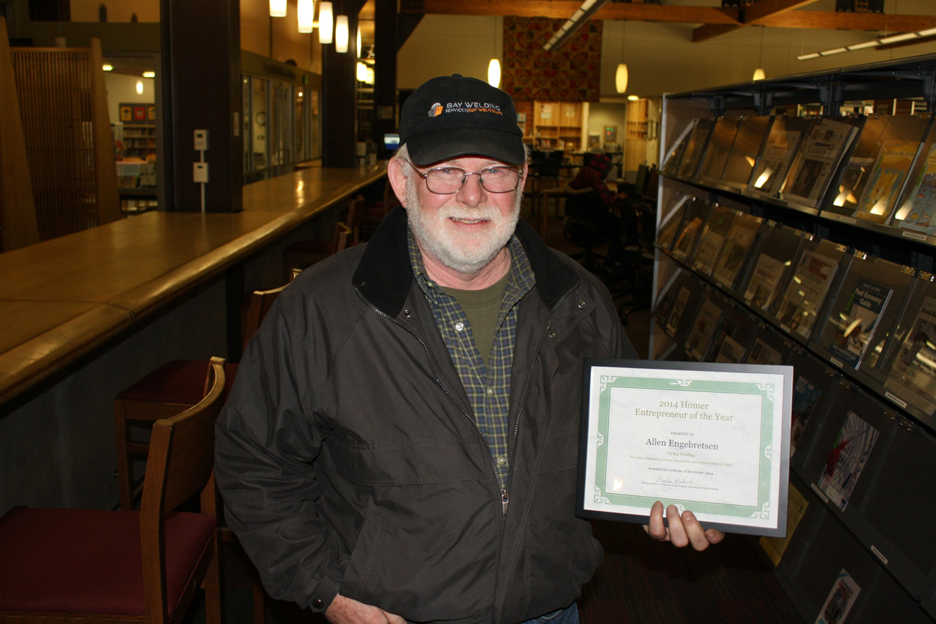 “Entrepreneur of the Year” winner, Allen Engebretsen of Bay Weld Boats, poses with his award Nov. 20 at the Homer Public Library. Engebretsen started his business in 1974.-Photo by Lindsay Olsen