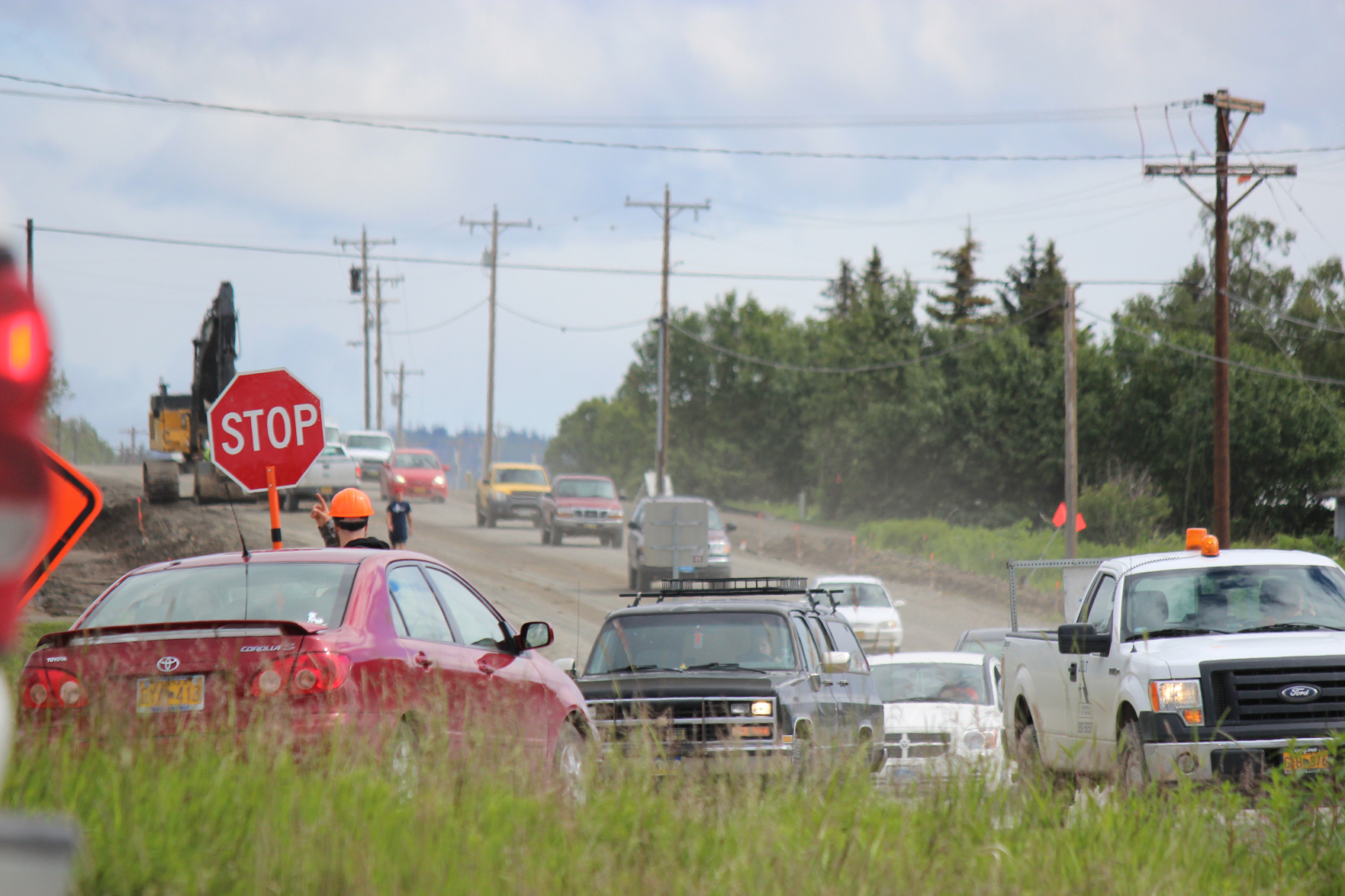 One lane of traffic is halted at the intersection of East End Road and Kachemak Drive on Tuesday, while oncoming traffic maneuvers through road construction activities taking place between mile 3.75-12.1.-Photo by McKibben Jackinsky,  Homer News