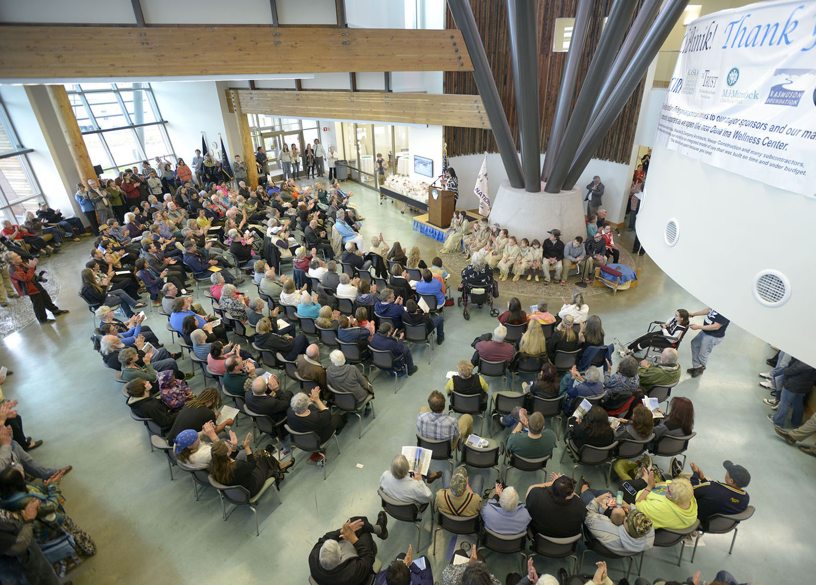 A standing-room-only crowd applauds June 12 as Kenaitze Indian Tribe Executive Director Jaylene Peterson-Nyren makes opening remarks during the first day of a three-day grand opening ceremony for the Dena’ina Wellness Center located in Old Town Kenai.-Photo by M. Scott Moon, Kenaitze Indian Tribe