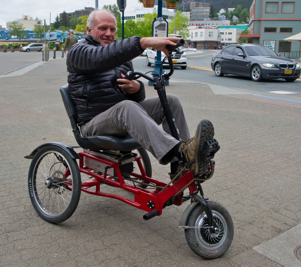 At right, Bob Janes shows the tight turning radius of his new electric-assisted tricycle in downtown Juneau recently.-Photo by Michael Penn, Morris News Service - Alaska
