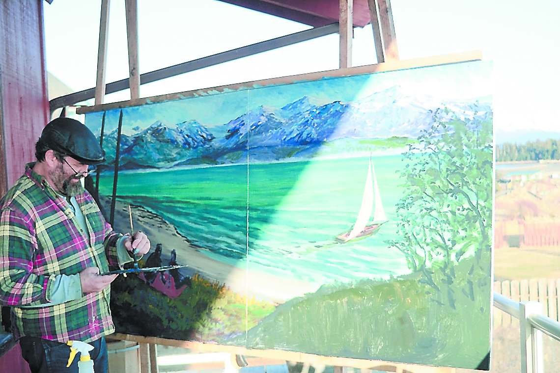 Homer artist Dan Coe, above, finishes a painting he did during a First Friday “paint in” on the back deck of the Homer Elks Lodge. At right, Coe starts his work. Organizers plan to have an artist every First Friday create an original work at the lodge. -Photos by Michael Armstrong, Homer News