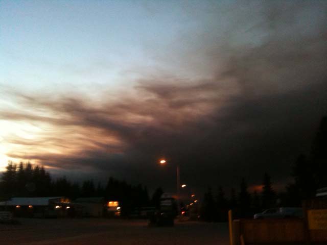 Early Tuesday morning, smoke from a fire on Funny River Road, east of Soldotna, was making its way south to the Homer area.-Photo by McKibben Jackinsky