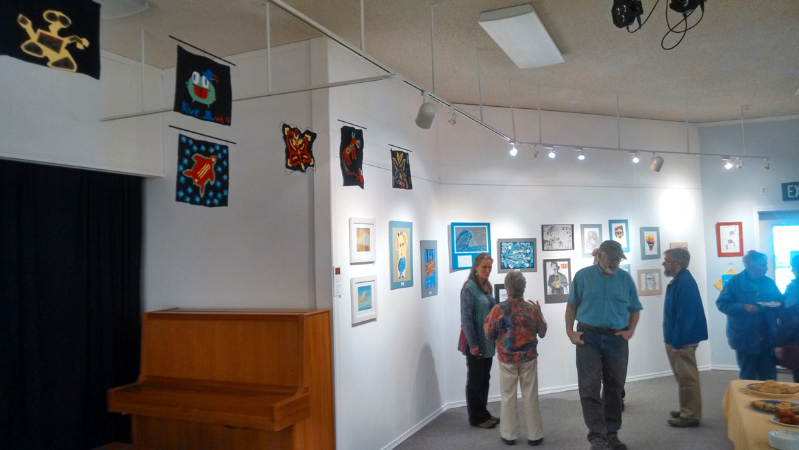 Visitors view art at the Jubilee Youth Art Exhibit at the Homer Council on the Arts on April 3.-Photo provided