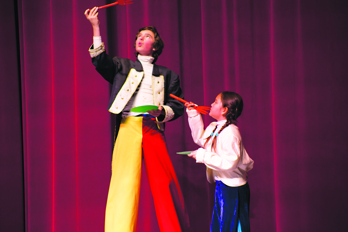 Simon Lopez, left, and Marina Co, right, perform a clown skit, “Fast Food,” last Saturday at the Homer Council on the Arts Jubilee Performing Arts Show. The show featured musical, theater, circus skills, dance and other acts by local youth.-Photo by Aaron Carpenter, Homer News
