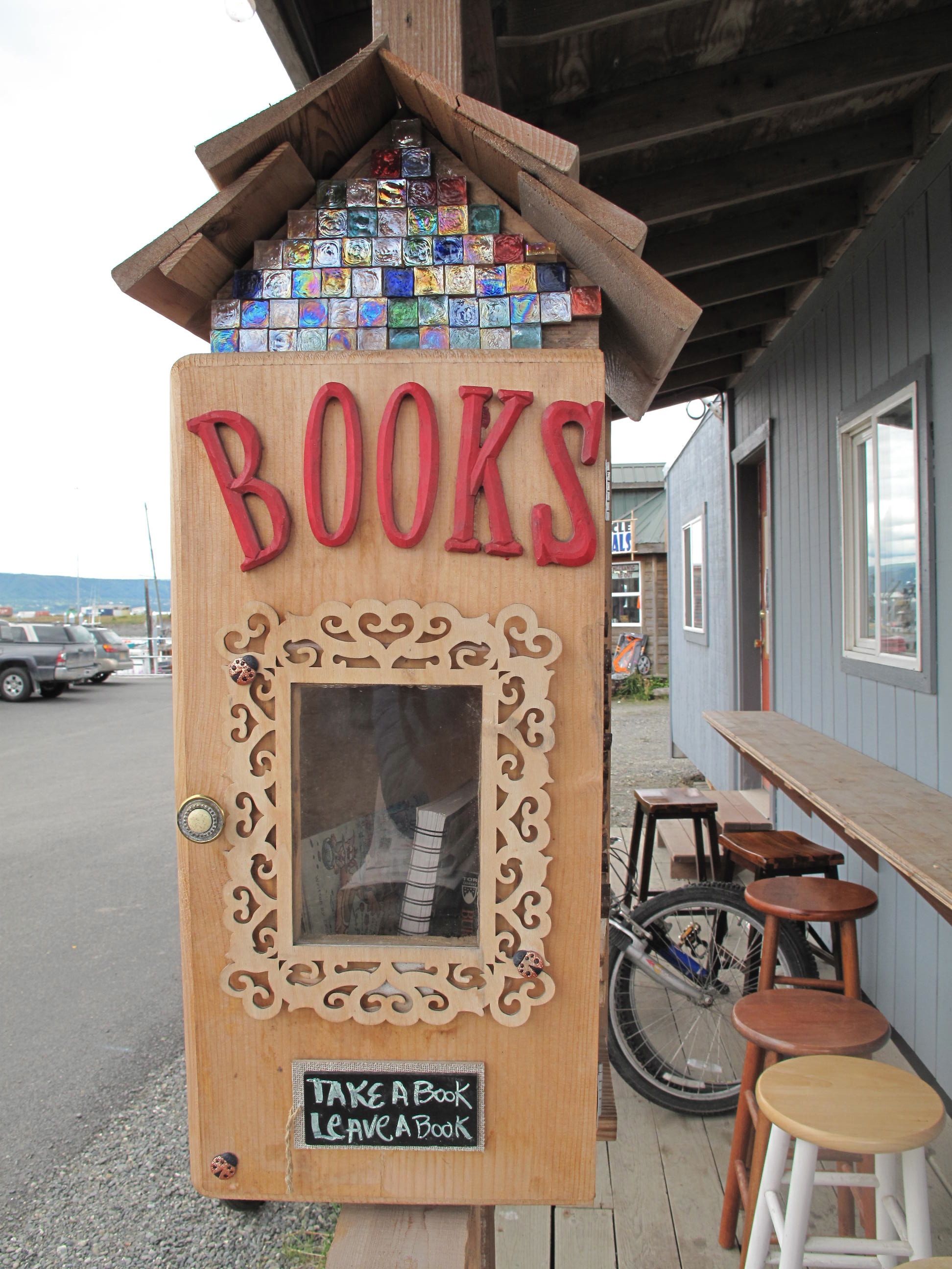 Take a book or leave a book at the micro-library outside La Baleine Cafe.-Photo by Miranda Weiss