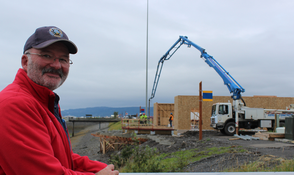 Harbormaster Bryan Hawkins checks on the progress of the new Harbormaster’s Office being built by Steiner’s North Star Construction.-Photo by McKibben Jackinsky, Homer News