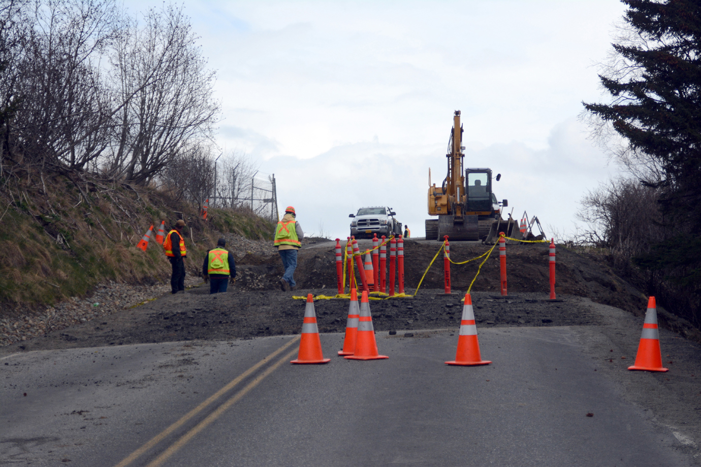 Alaska Department of Transportation and Public Facilities workers inspect repairs on the collapsed section of Kachemak Drive on Tuesday.-Photo by Michael Armstrong, Homer News