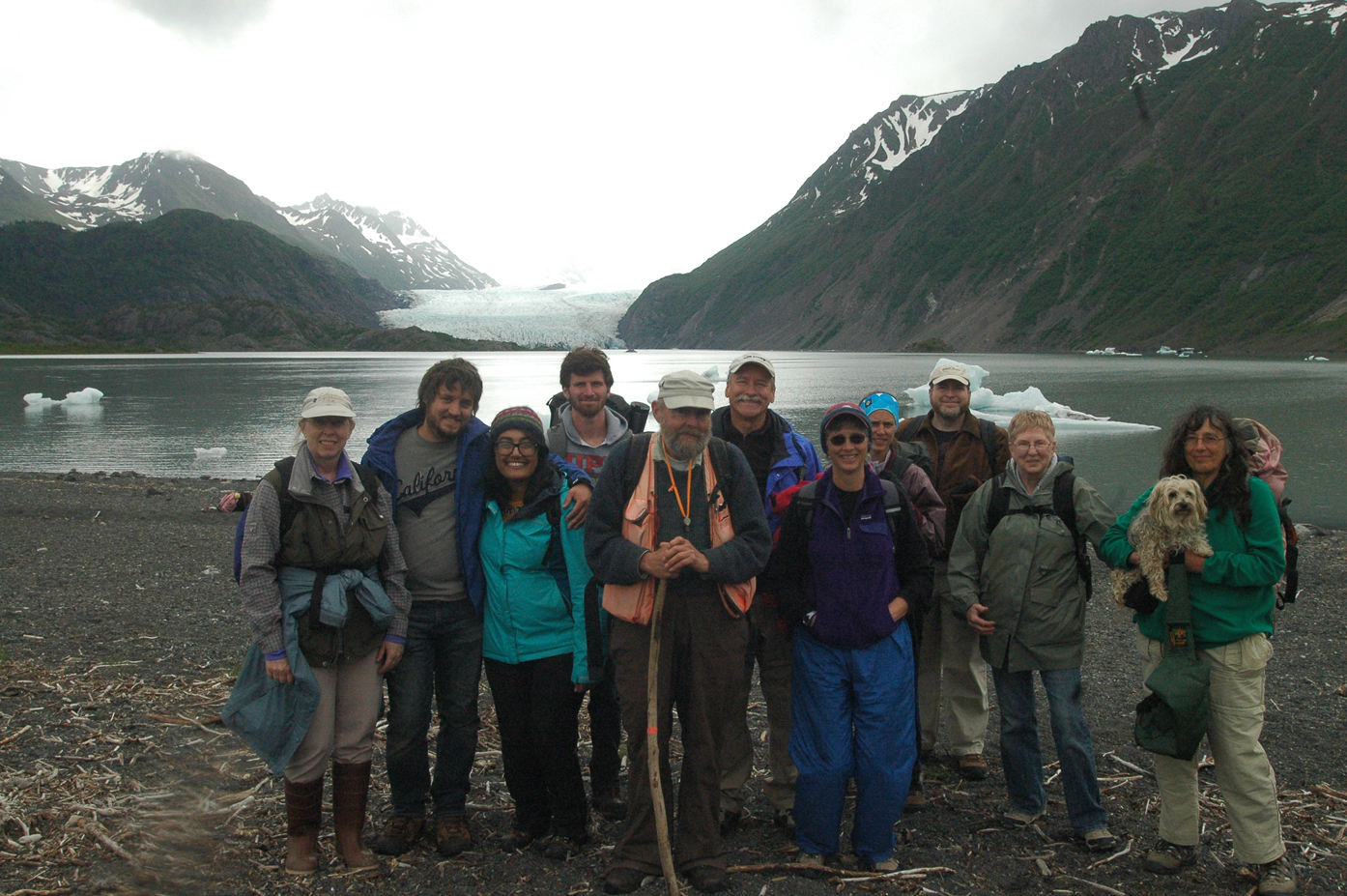 Volunteers pause in front of Grewingk Glacier Lake during the annual Trails Day on Saturday. Ed Berg, geology instructor at Kachemak Bay Campus (center wearing orange vest), led the family hike. From left are Nancy Larsen, Jeremy Sitarek, Melanie Prasad, Pryce Ragains, Berg, Don Reed, Holly Van Pelt, Michelle Waclawski, Phillip Waclawski, Diane Waclawski and Carol Sharat.-Photo by Shannon Reid