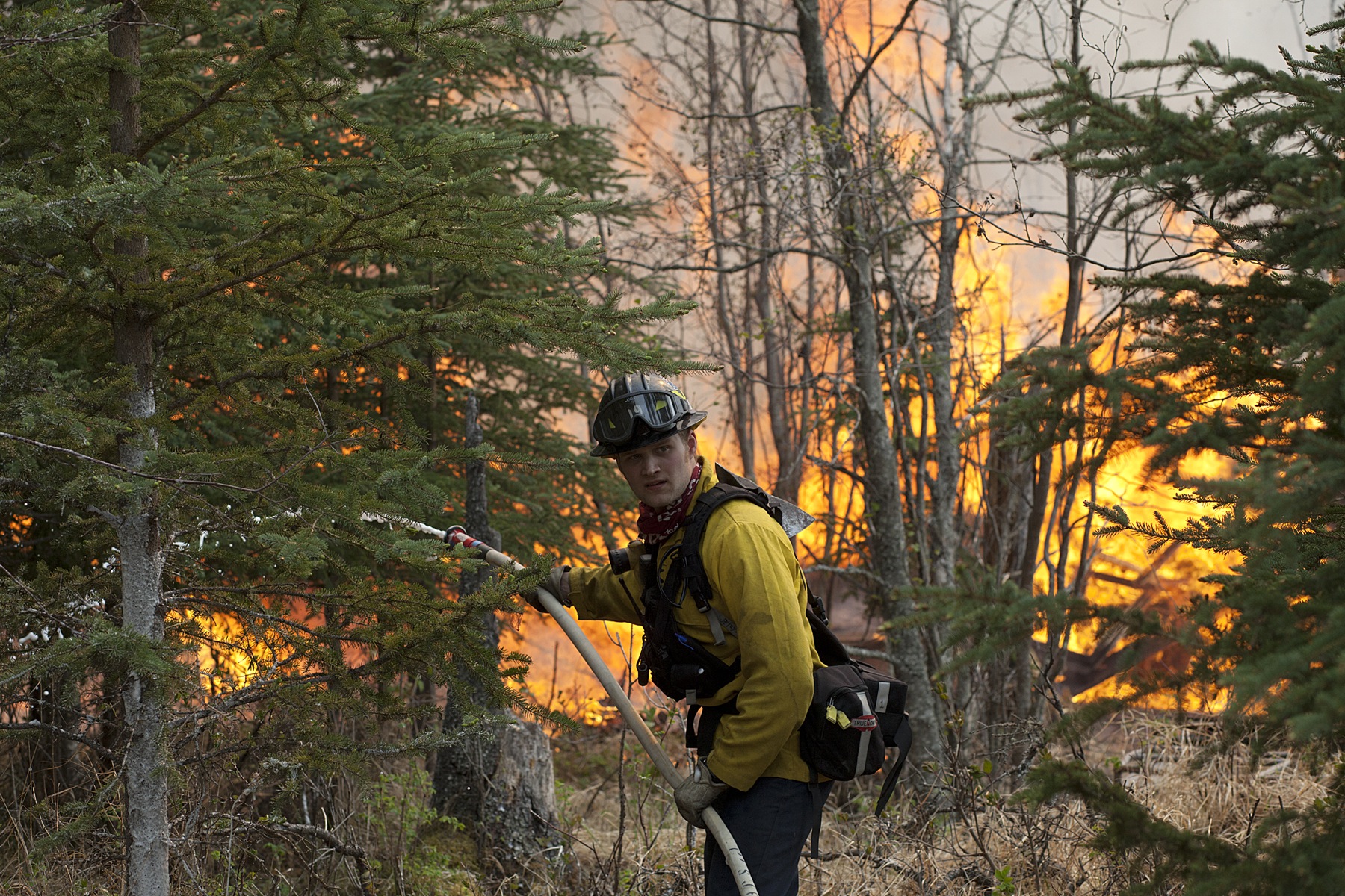Central Emergency Services firefighter Spencer Mclean works to contain a portion of the 156,041 acre Funny River Horse Trail wildfire near the Funny River neighborhood Sunda yMay 25, 2014 in Soldotna, Alaska.-Photo by Rashah McChesney/Morris News Service-Peninsula Clarion
