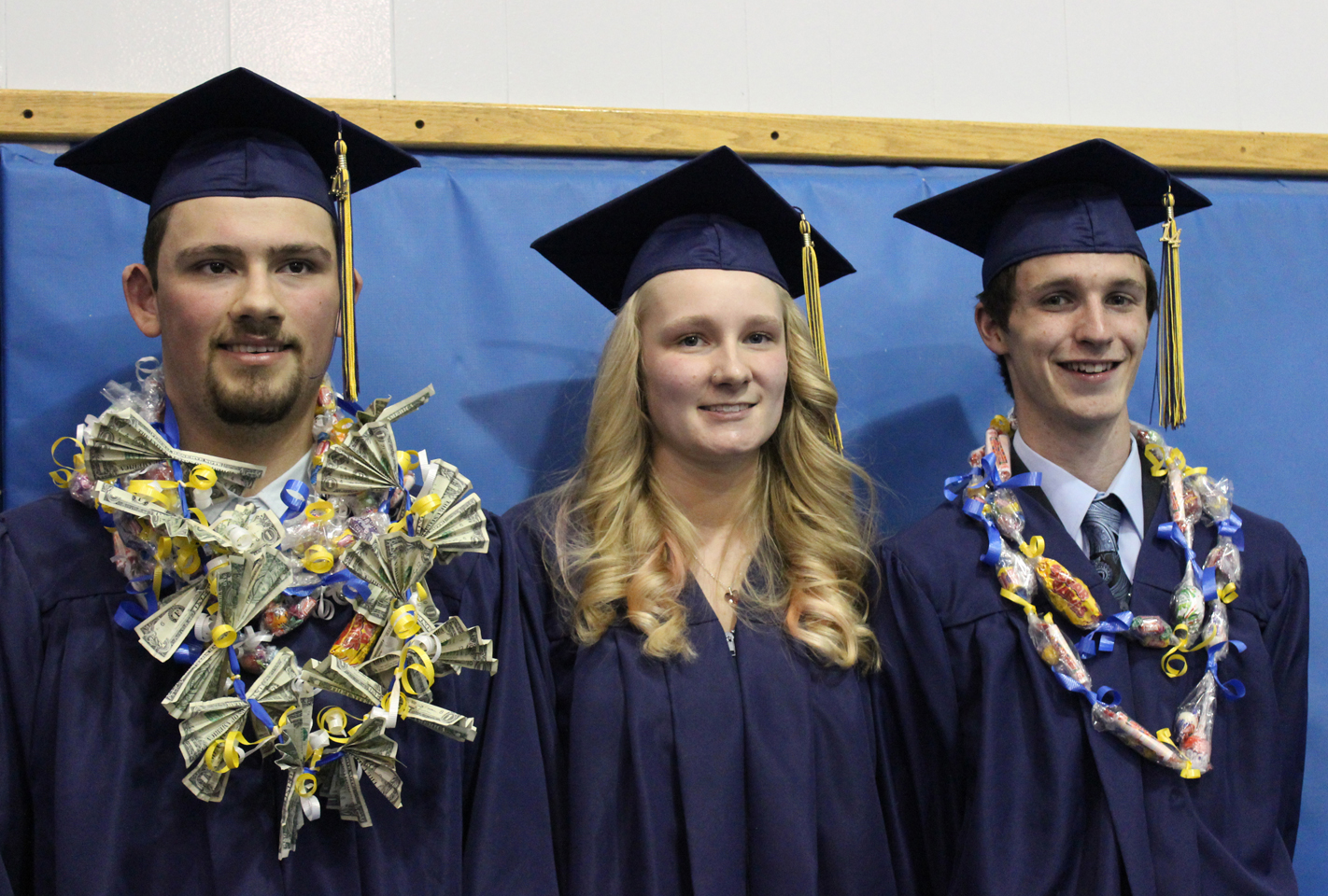 Ninilchik Class of 2014 Robert Delgado, Jessica Rogers and Matthew Thorne pose for photos after the May 21 commencement ceremony.
