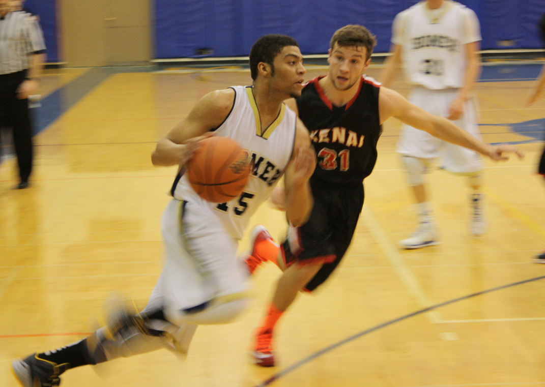 Mariner Jaruby Nelson maneuvers the ball past a Kenai Kardinal opponent.-Photo by Lindsay Olsen
