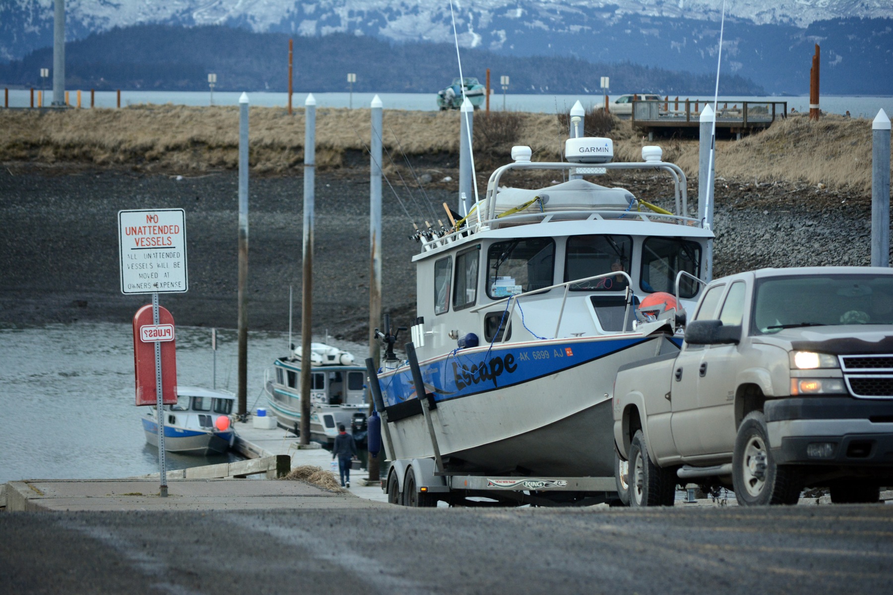 Fishermen launch their boats at the Homer Harbor on Friday morning. All lanes at the load-launch ramp were occupied and others waited to get a start on fishing.-Photo by Michael Armstrong, Homer News