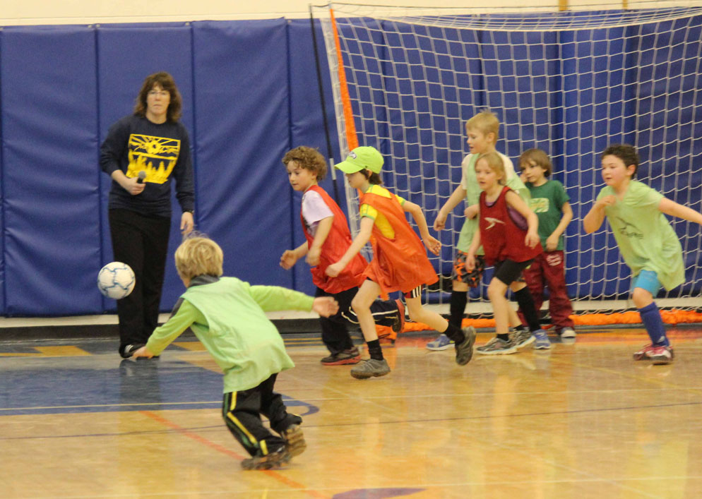 Lady Mariner assistant coach Wendy Todd keeps an eye on the action at Saturday’s soccer clinic.-Photo by McKibben Jackinsky, Homer News